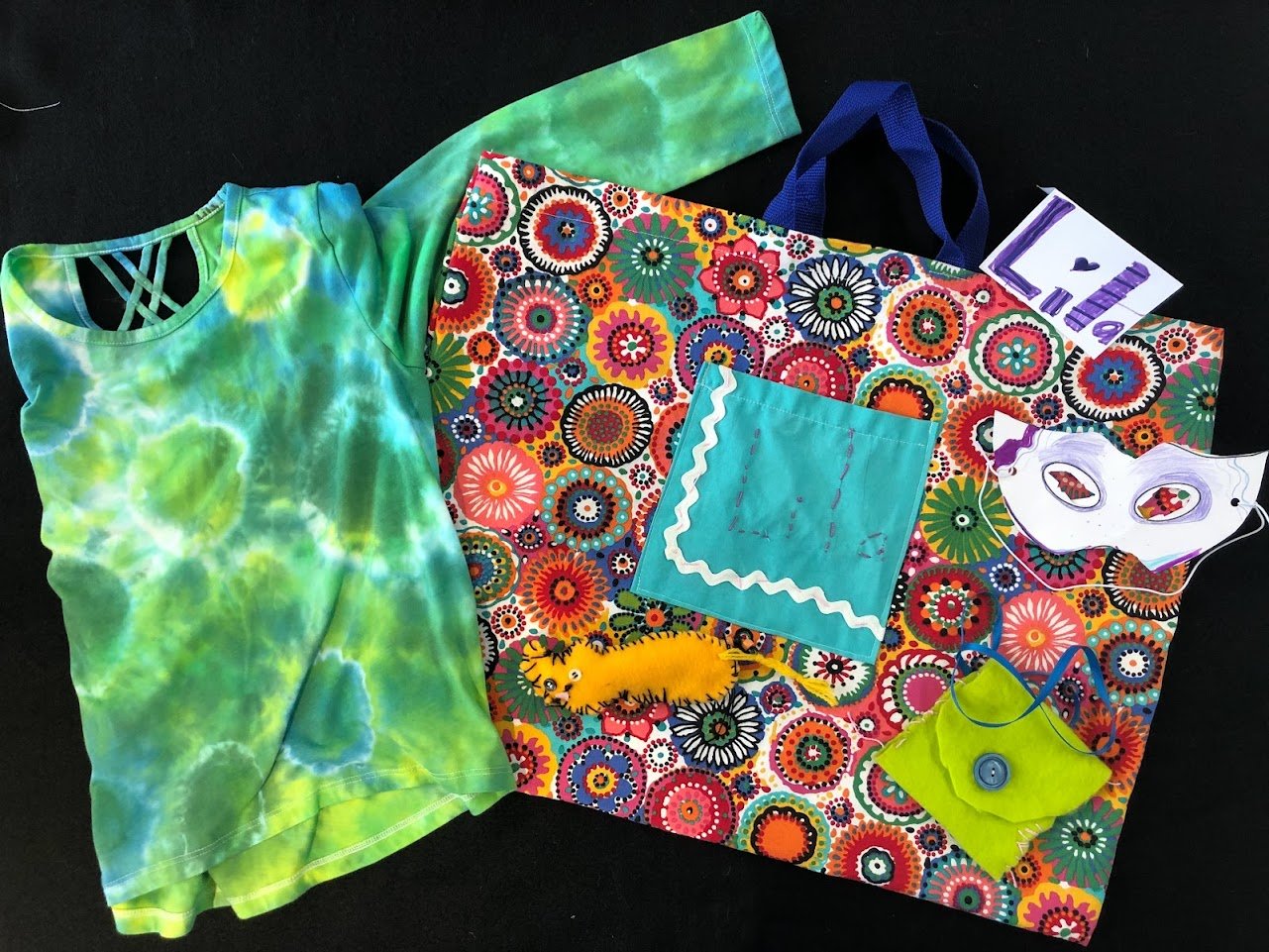 LH's  Tie-dye shirt, Tote with embroidered pocket, Pocket Pouch, and Eye Mask