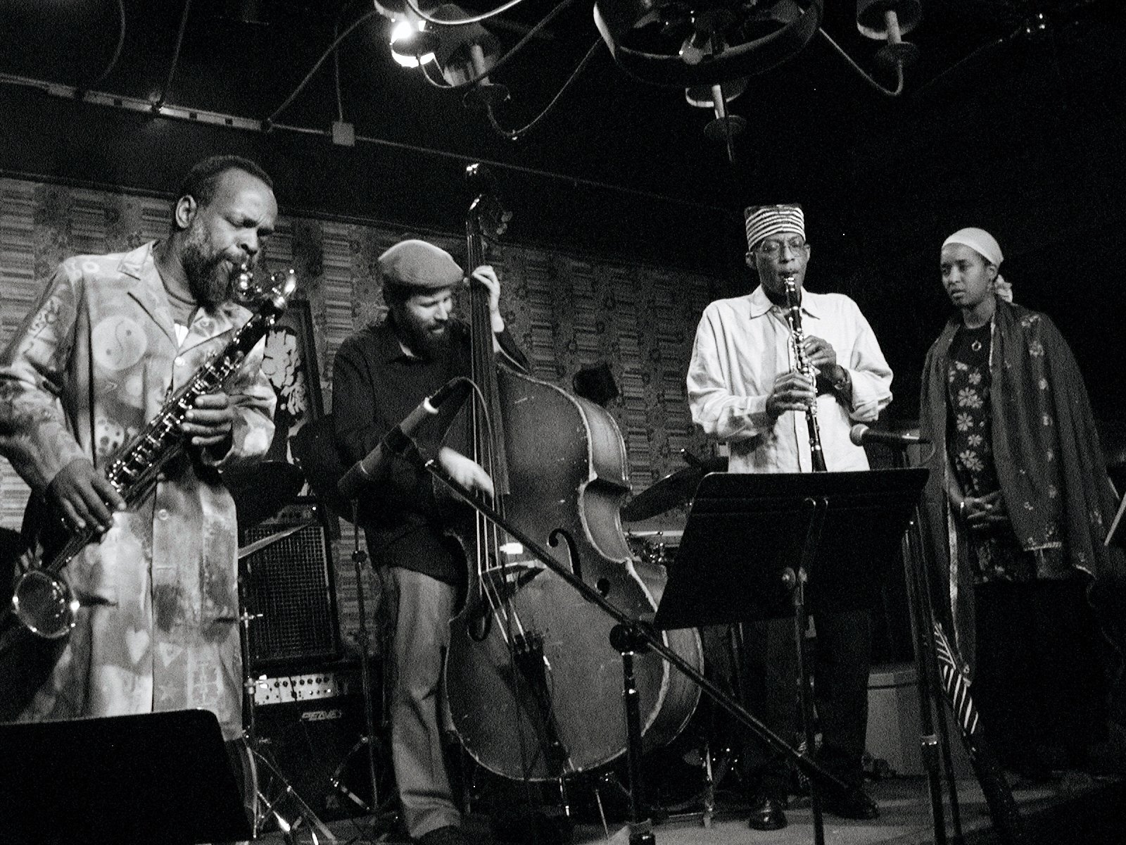   Velvet photo three: Spoken-word artist Mankwe Ndosi savoring the set-up provided by bass clarinetist Douglas Ewart, bassist Joshua Abrams, and clarinetist Mwata Bowden. (Photo by Lauren Deutsch)   