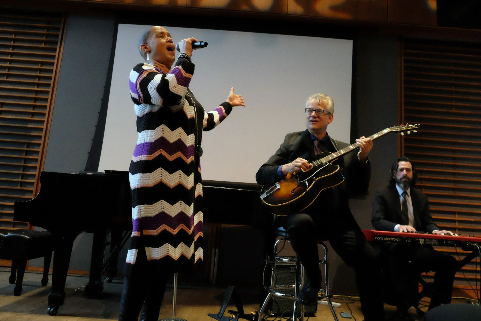 "Sister" Margaret Murphy-Webb singing "Fly Me to the Moon," accompanied by Mike Allemana and organist Pete Benson. (Photograph by Lauren Deutsch)