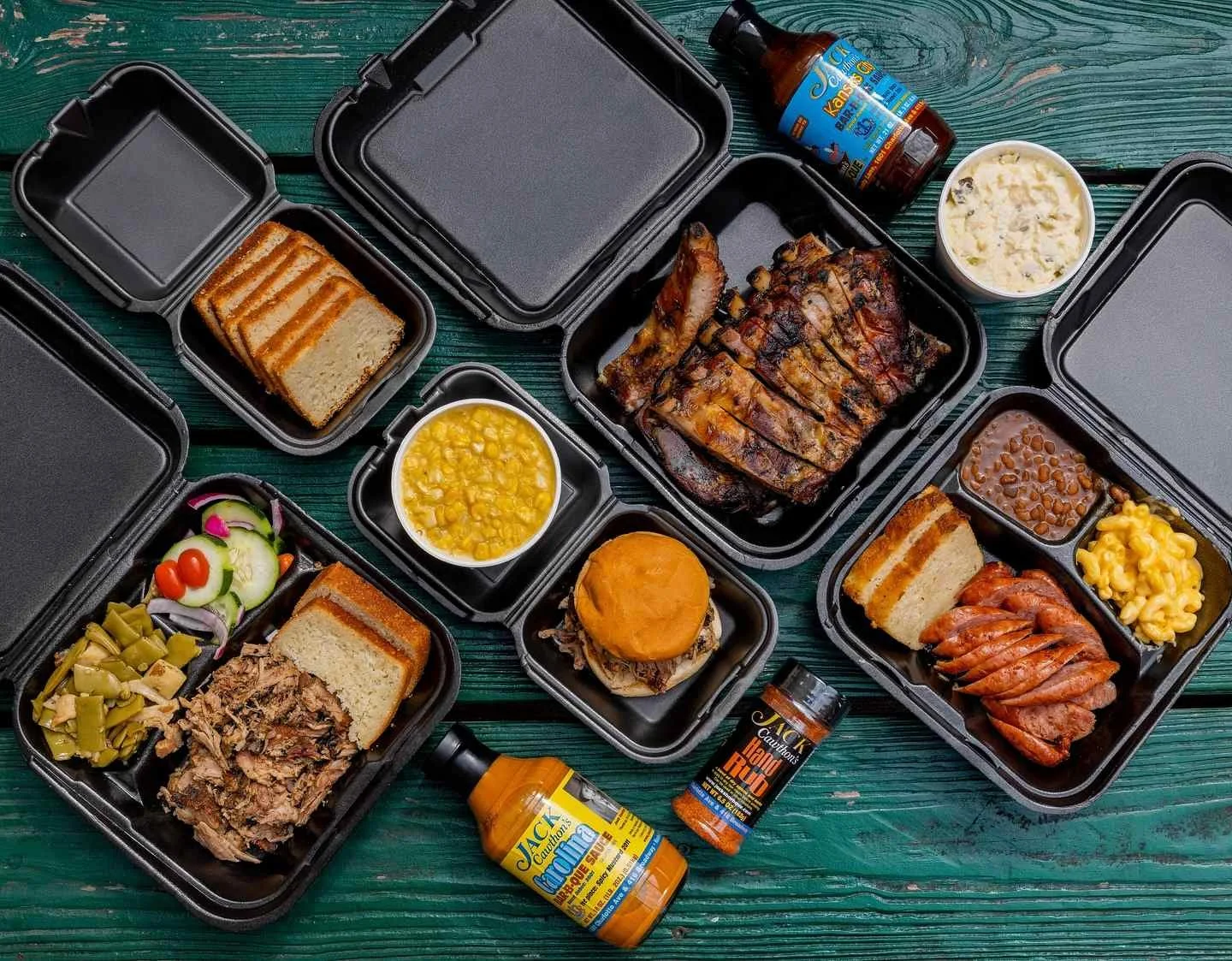 Nashville BBQ spread featuring smoked meats, pulled pork, beef, turkey, bread, and classic Southern sides