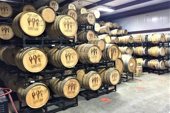 Guests learning about whiskey making during a guided Tennessee craft distillery tour