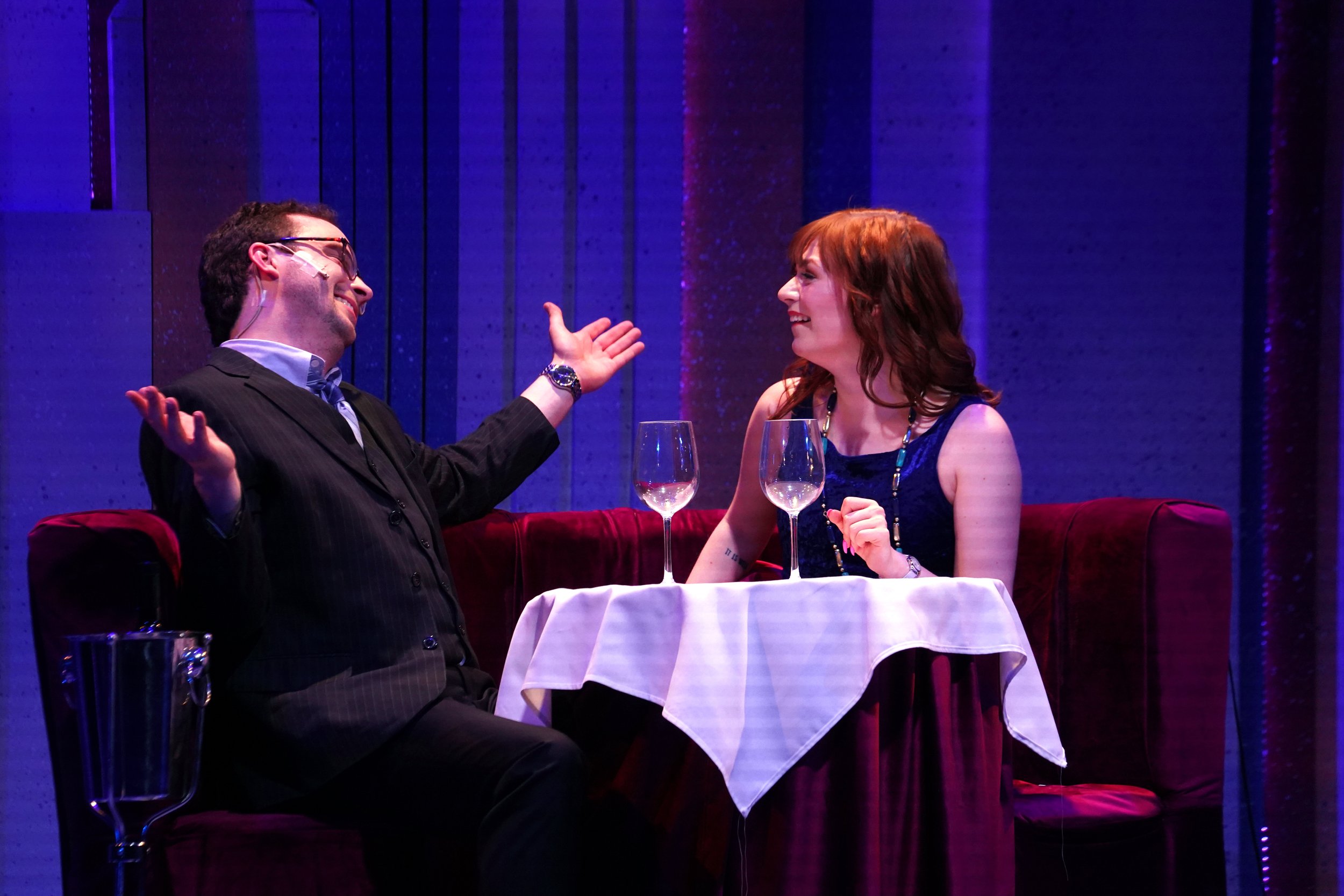   TOP: Carson Eubank, Ashlee Waldbauer, and the ensemble; ABOVE: Carson Eubank as Vernon Gersch and Ashlee Waldbauer as Sonia Walsk, in ‘They’re Playing Our Song.’ Photo by Suzanne Rossi.  
