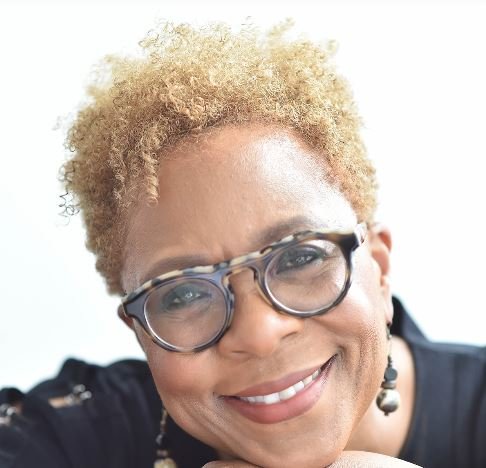 Actor in glasses smiles