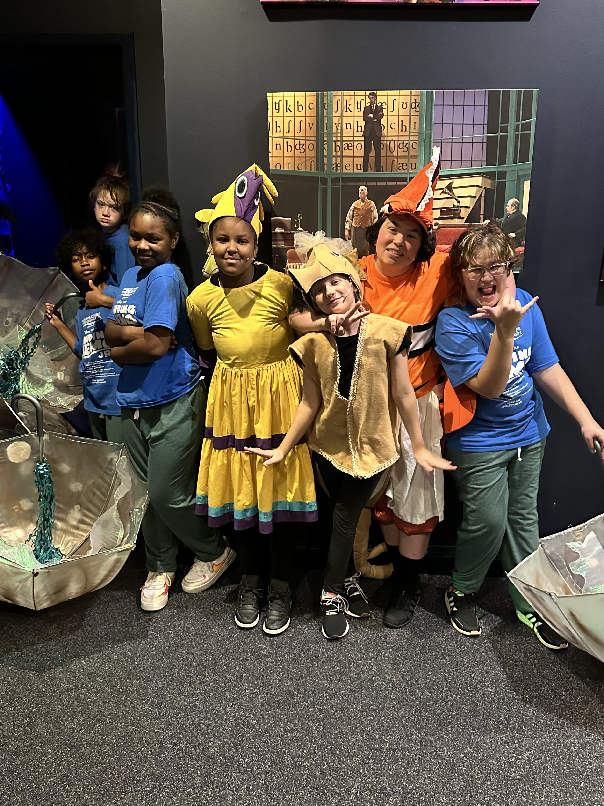 Actors in Finding Nemo Jr. preparing backstage before their performance