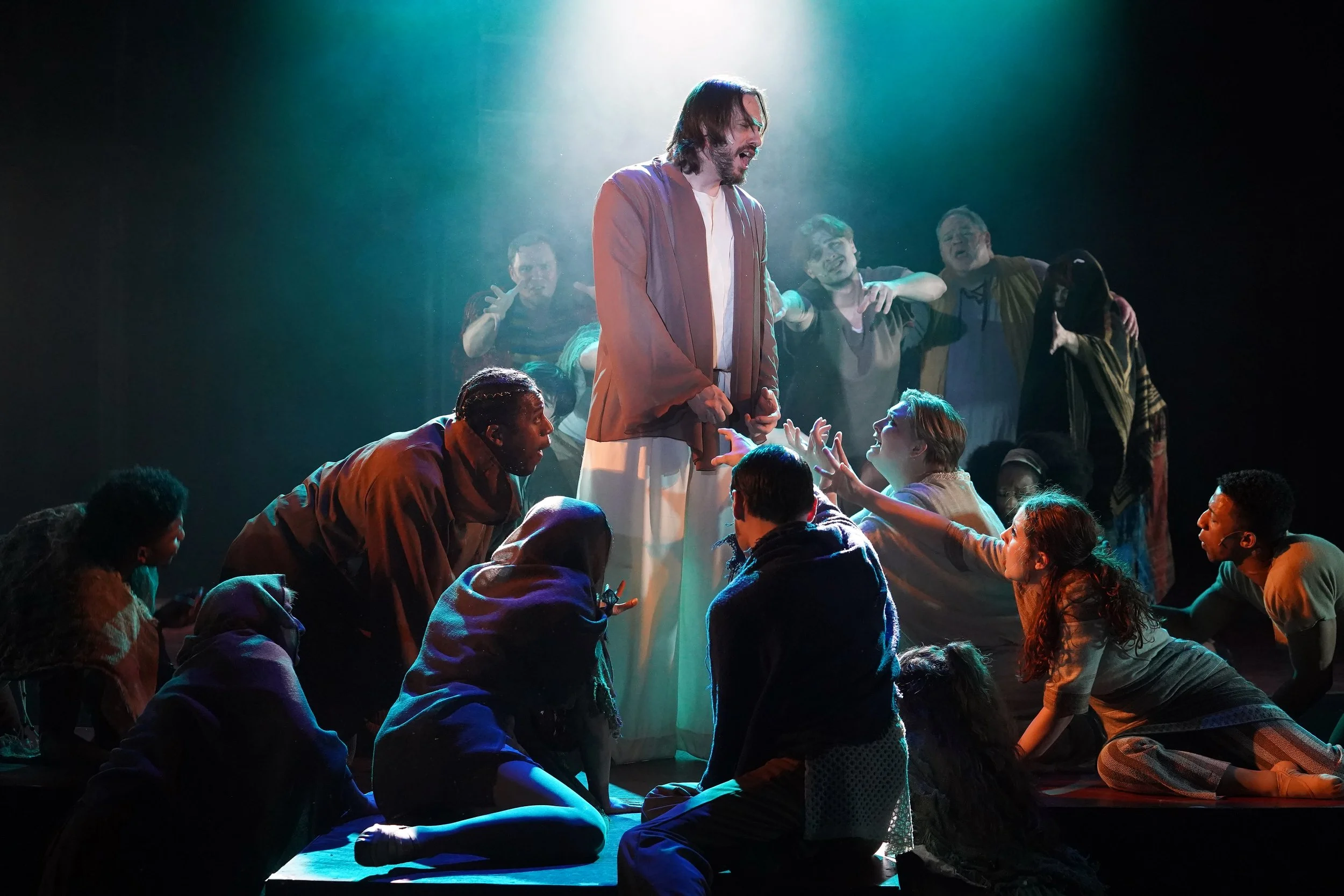   Kevin Cleary (center, bathed in light) played the lead role of Jesus in Riverside Center for the Performing Arts' production of 'Jesus Christ Superstar,' which opened March 12 and runs through April 27. (Photos by Suzanne Carr-Rossi)  