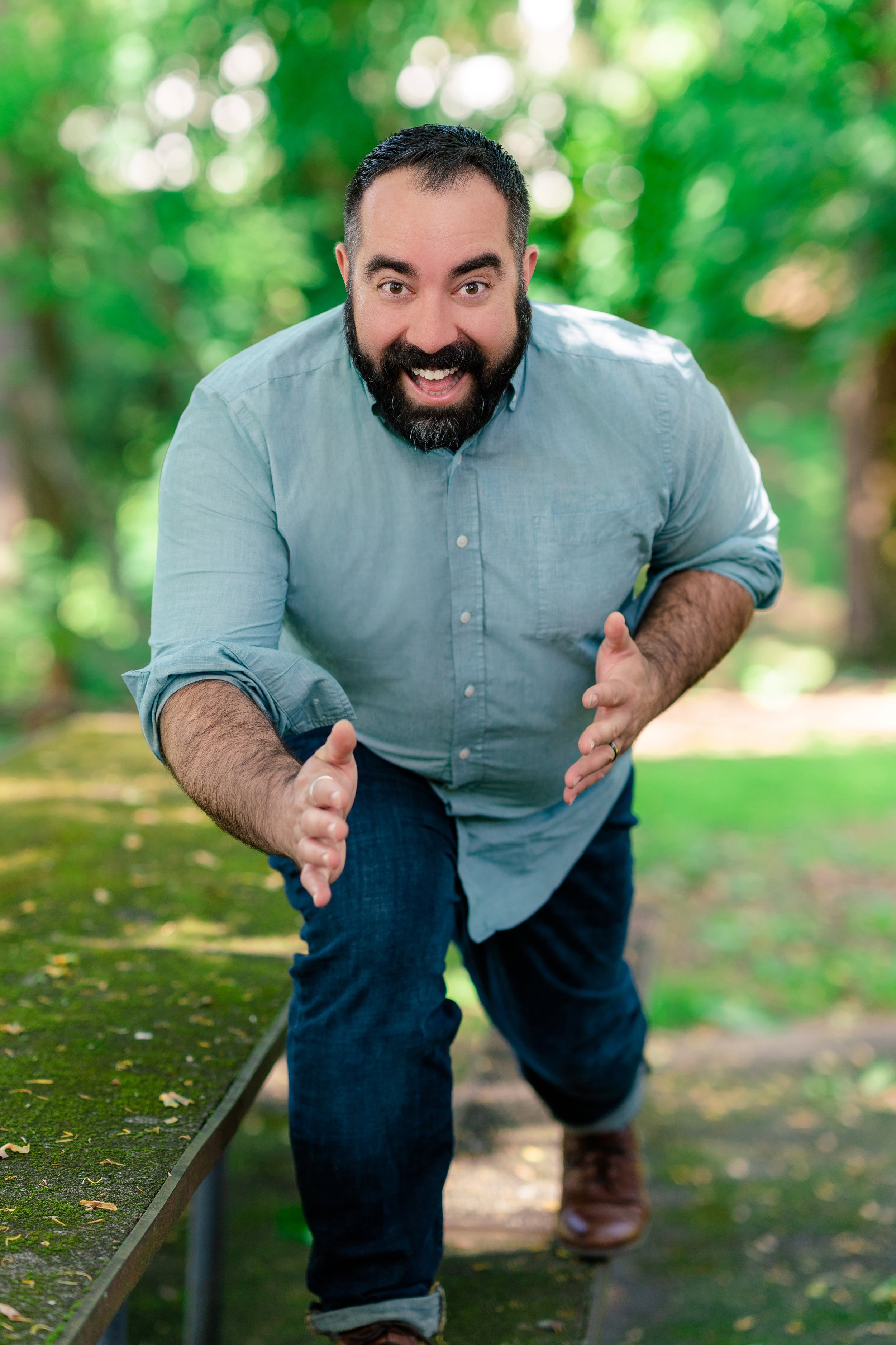 Michael Jonas smiling with a welcoming facial expression in a park in Portland, Oregon
