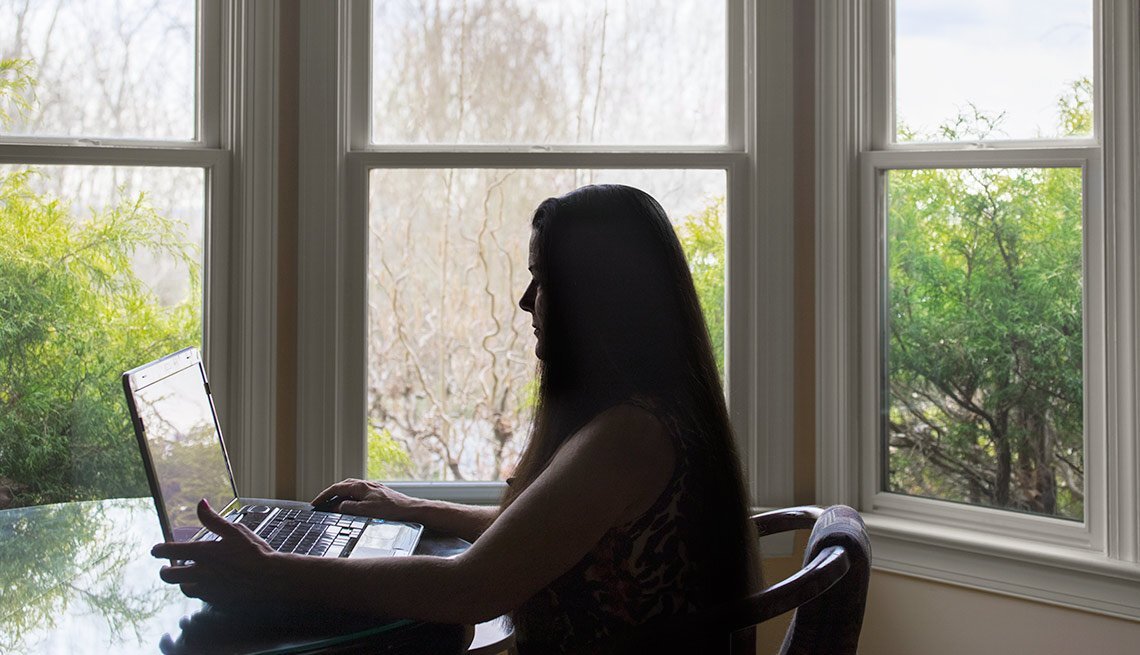 catfishing woman at desk.jpg