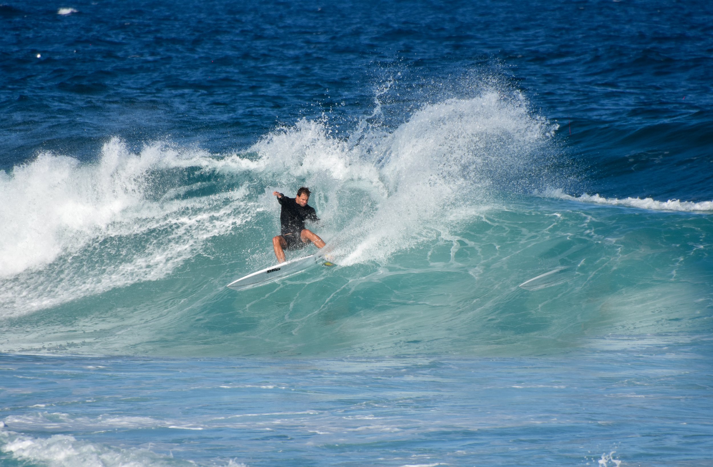Troy performs difficult surfing manoeuvre