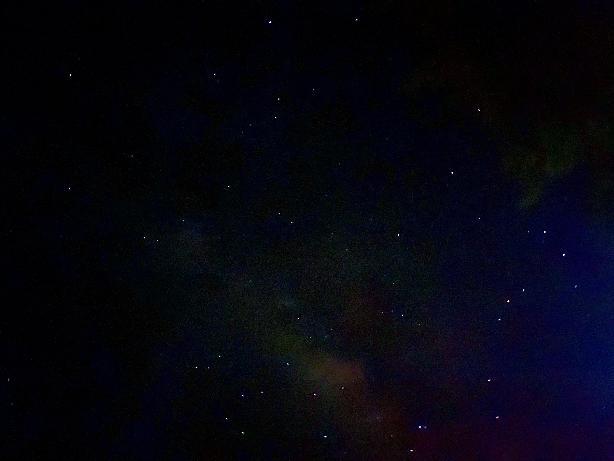 Astrophotography image of a star-filled night sky with the Milky Way visible near Mayhill, New Mexico.