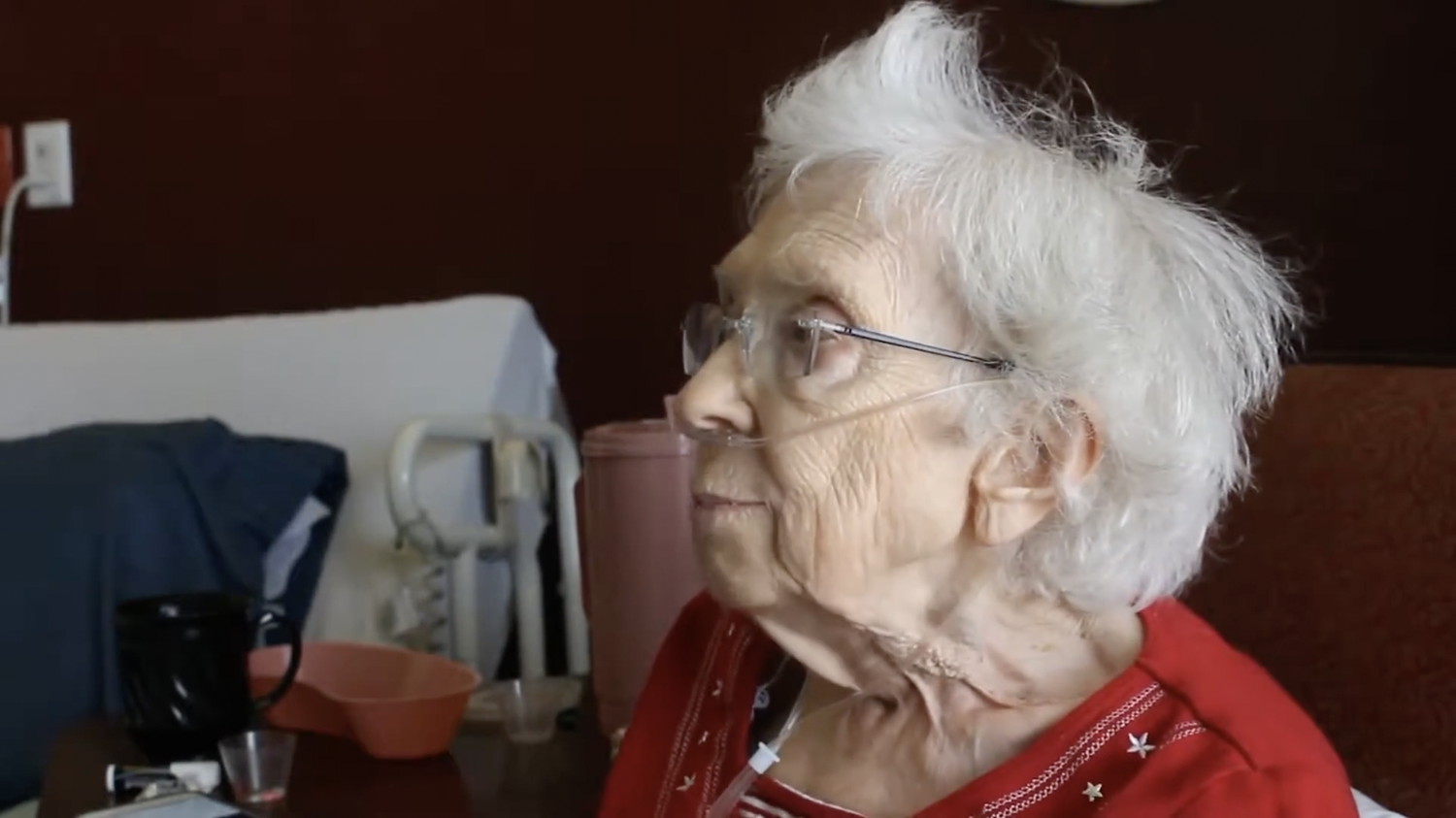 Close-up interview of a World War II and Great Depression survivor, filmed with intimate lighting and shallow depth of field for historical documentary storytelling.