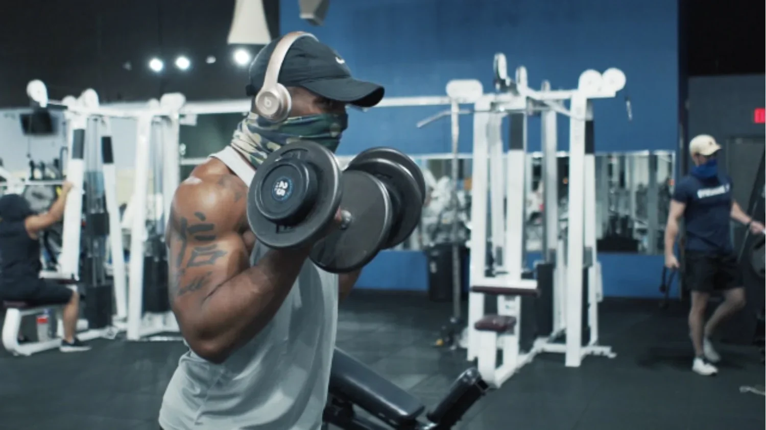 Fitness influencer interview filmed inside a gym environment, using dynamic lighting and composition to emphasize high-energy motivational storytelling.