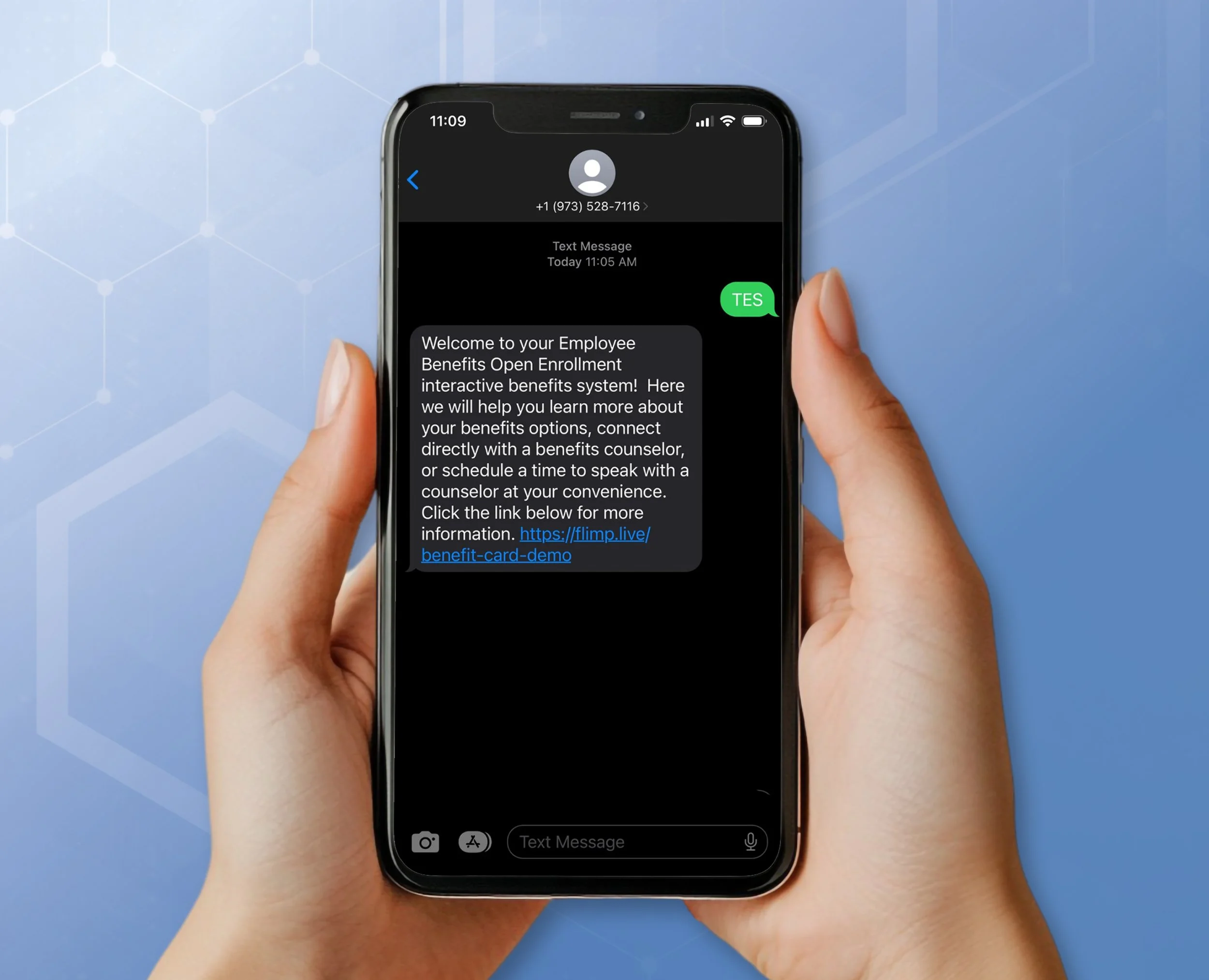 Close-up of a person holding an iPhone, showing a text message about employee benefits enrollment with a link for more information, against a blue background with a subtle hexagonal pattern.