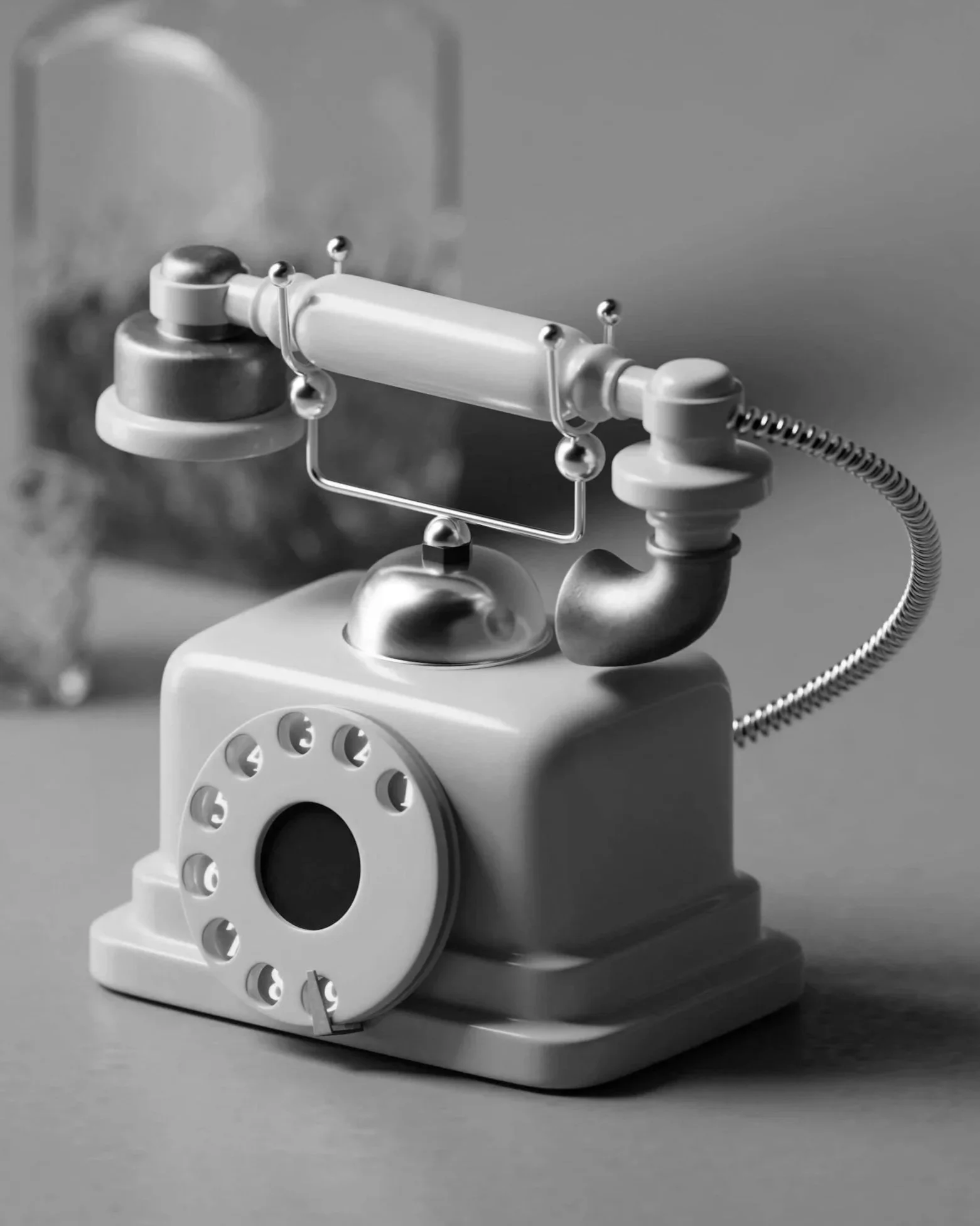 Black and white photo of a vintage rotary telephone with a spiral cord and a closed receiver on a flat surface.