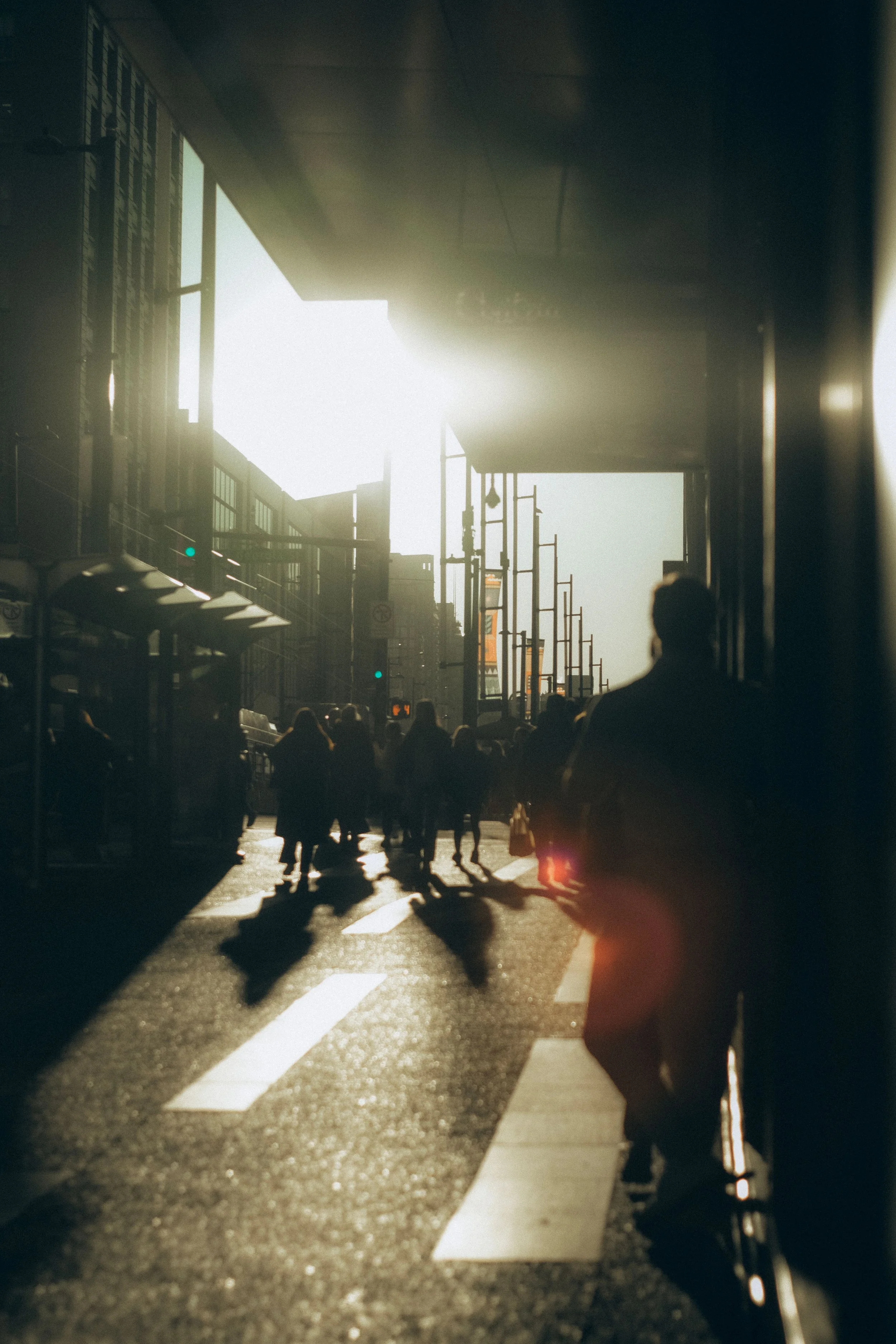 New York City street with people walking in sunlight, symbolizing place and society.