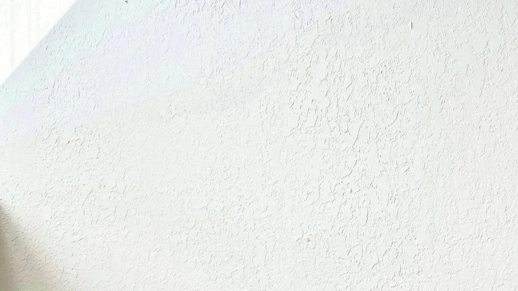 Wall with complex textured pattern and light and dark areas in Andrew Wilton LCSW, life transitions therapist's office near Buffalo in Western New York