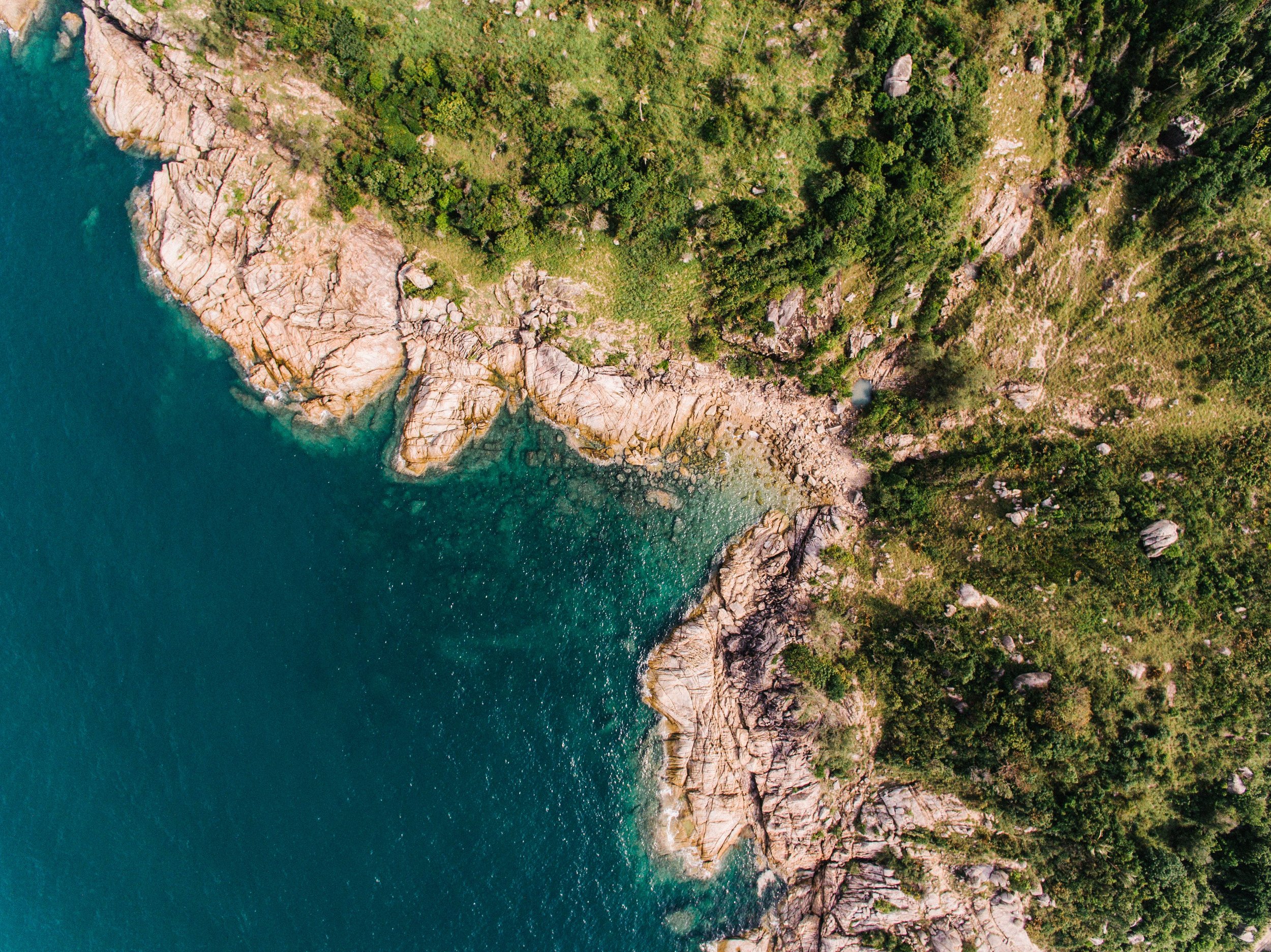 Coastline with rocky boundary from above, suggesting natural differences and challenging dynamics in relationships