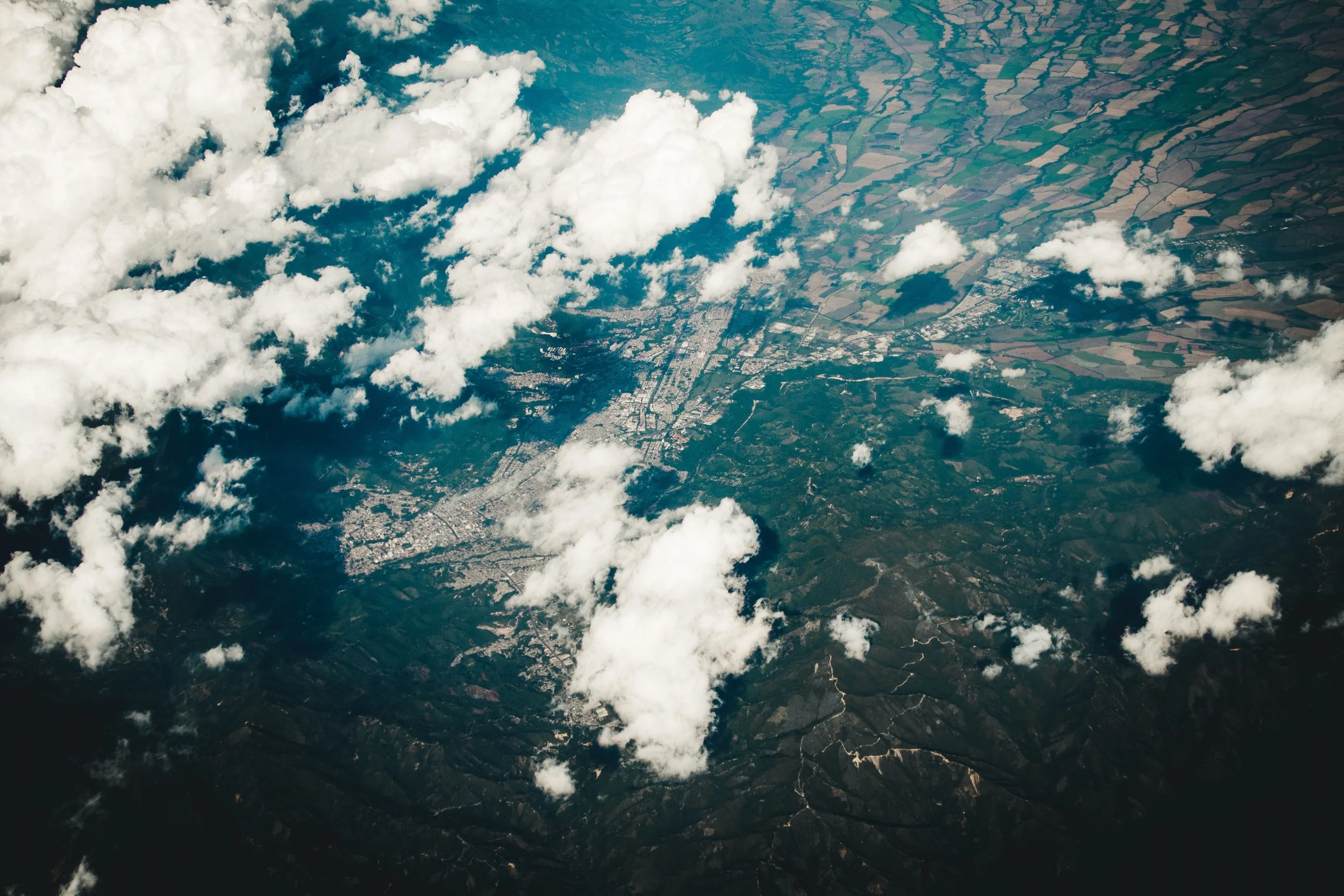 Aerial view of region with connecting channels and pathways, displaying widespread accessibility in online therapy via telehealth.