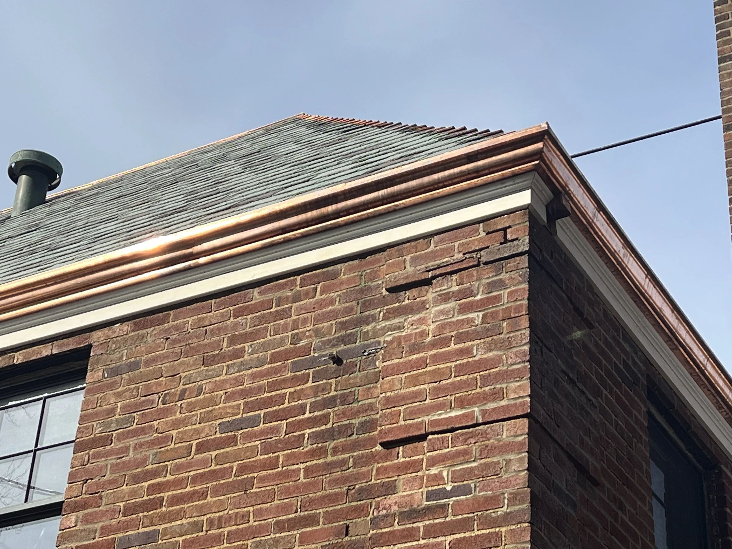 2 wall custom copper gutter with a slate roof