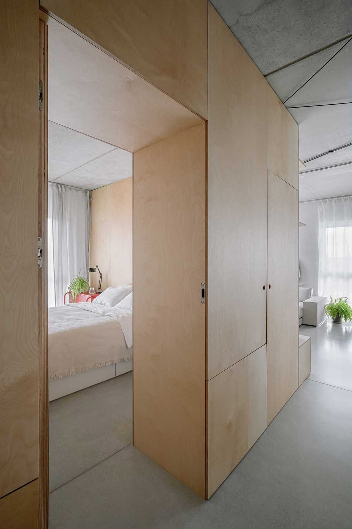 Custom built-in storage in Vancouver laneway house bedroom maximizing small space