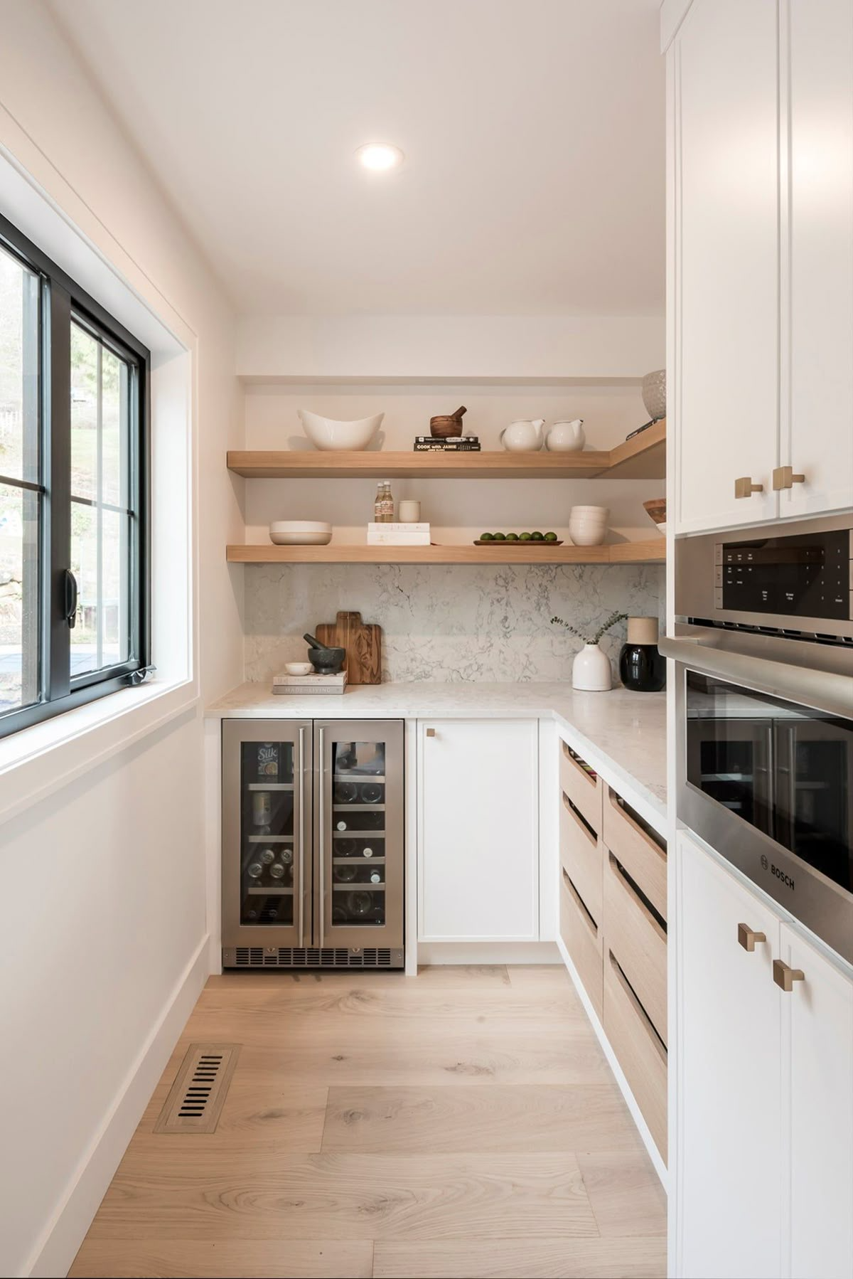 Butler's pantry with integrated wall oven and custom storage cabinetry in an east Vancouver character home kitchen renovation