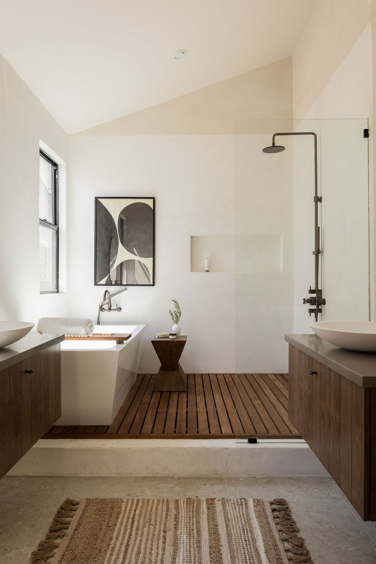 Curbless open shower with rainfall head and heated tile floor in a Vancouver Island bathroom renovation 2026