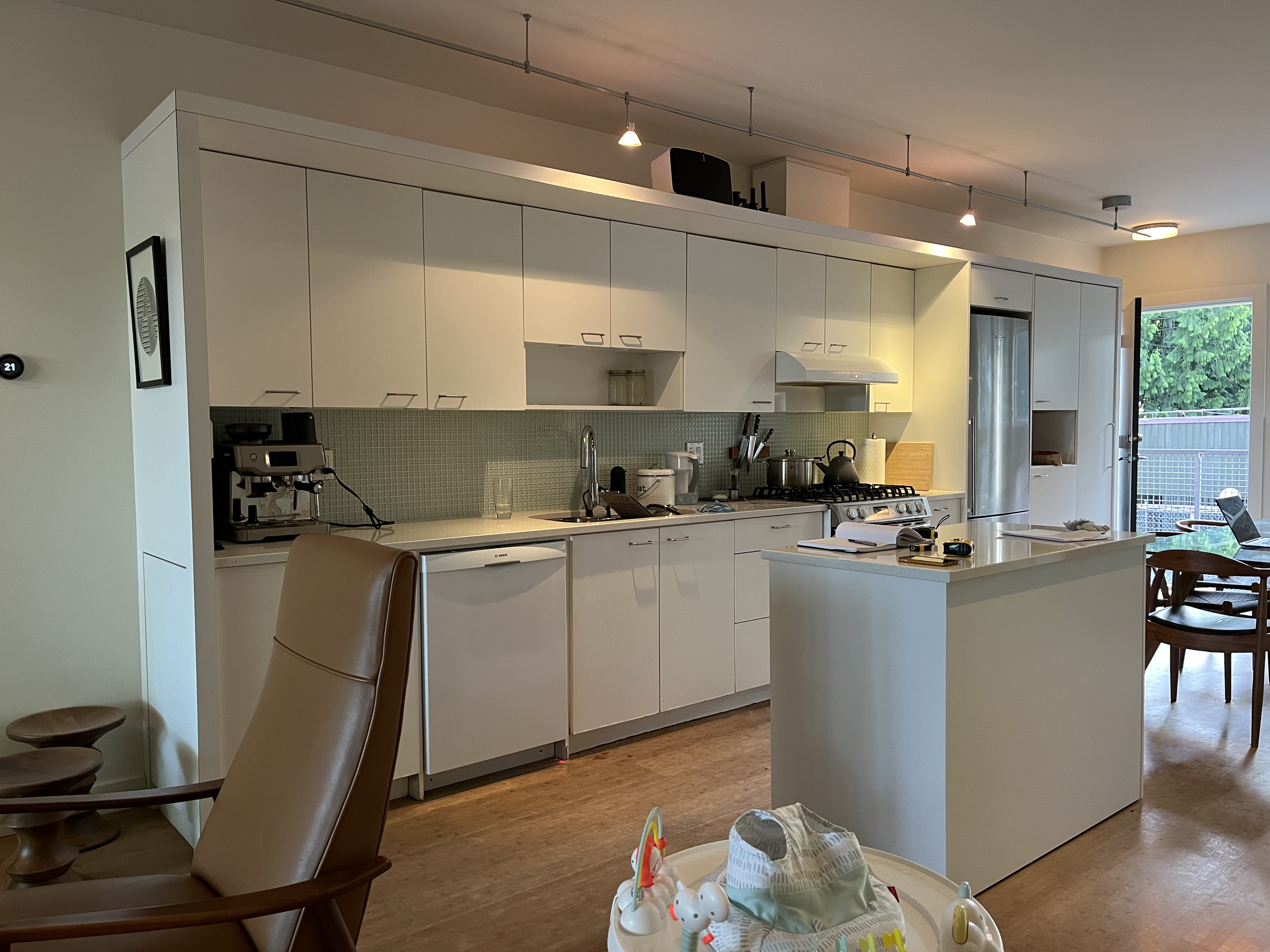 Before the facelift: a builder-basic East Vancouver kitchen with odd cabinetry, clunky layout, and all the charm of a rental unit waiting for personality