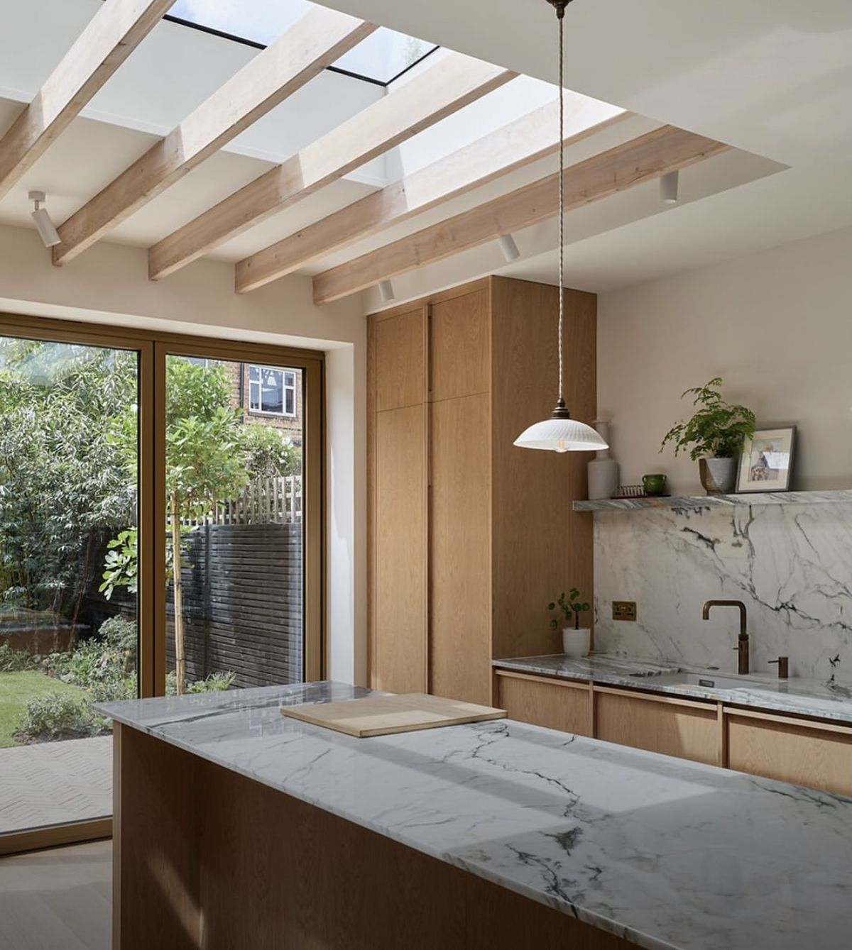 North Vancouver kitchen renovation with wood cabinets, large island and modern fixtures