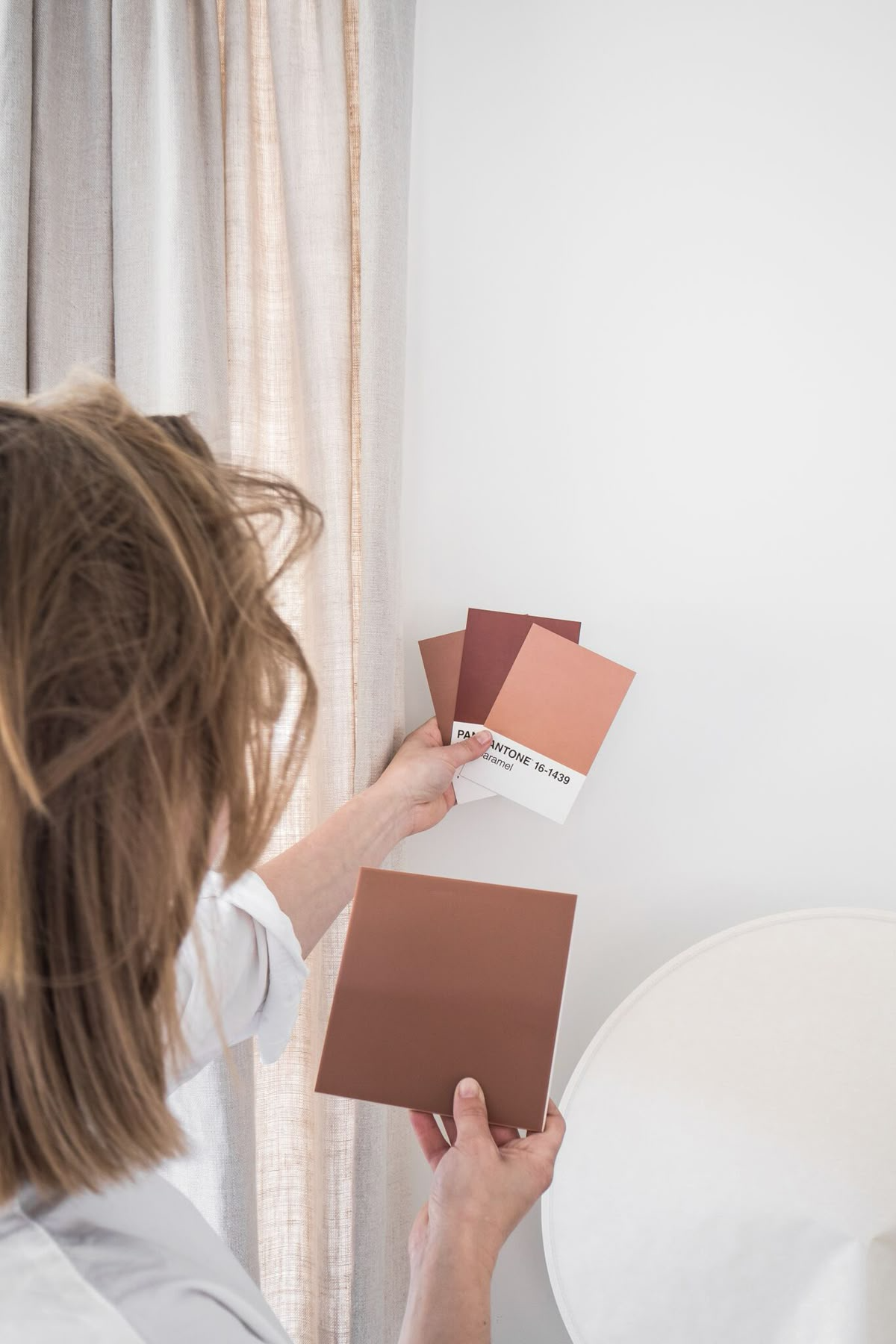 Designer walking a new homeowner through paint and material samples