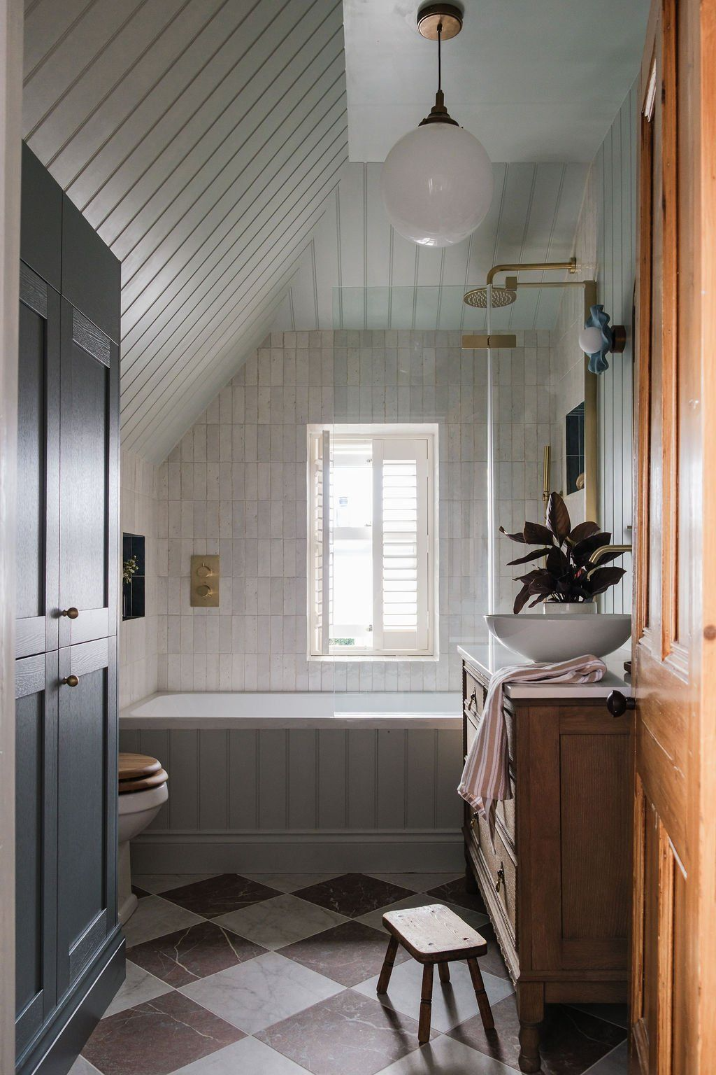 Heritage bathroom renovation with updated tile and classic drop in tub.