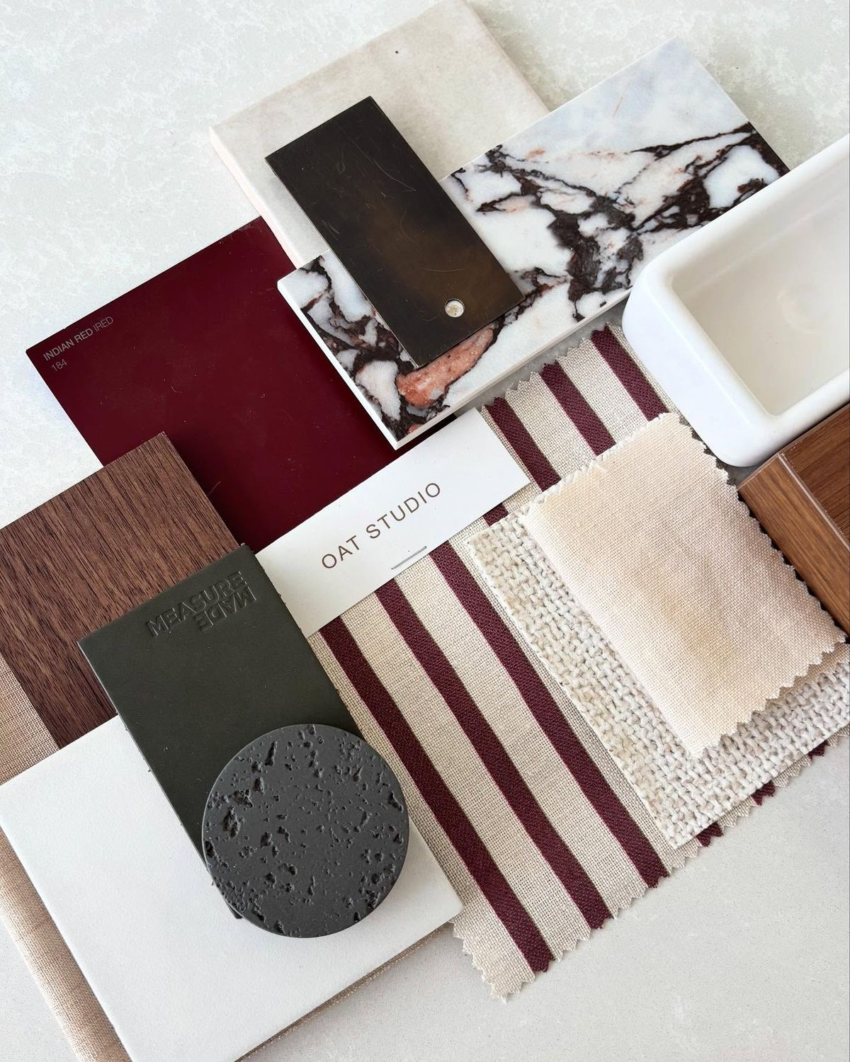 HART HOUS bathroom design concept board featuring warm stone, black fixtures, and oak vanity details