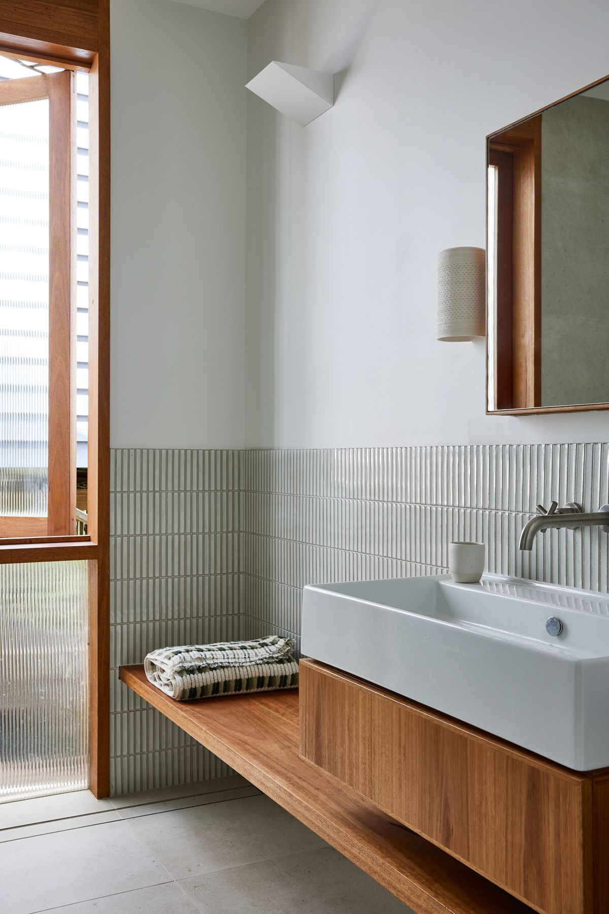 Modern Vancouver bathroom renovation with walk in shower, large vanity and brushed fixtures