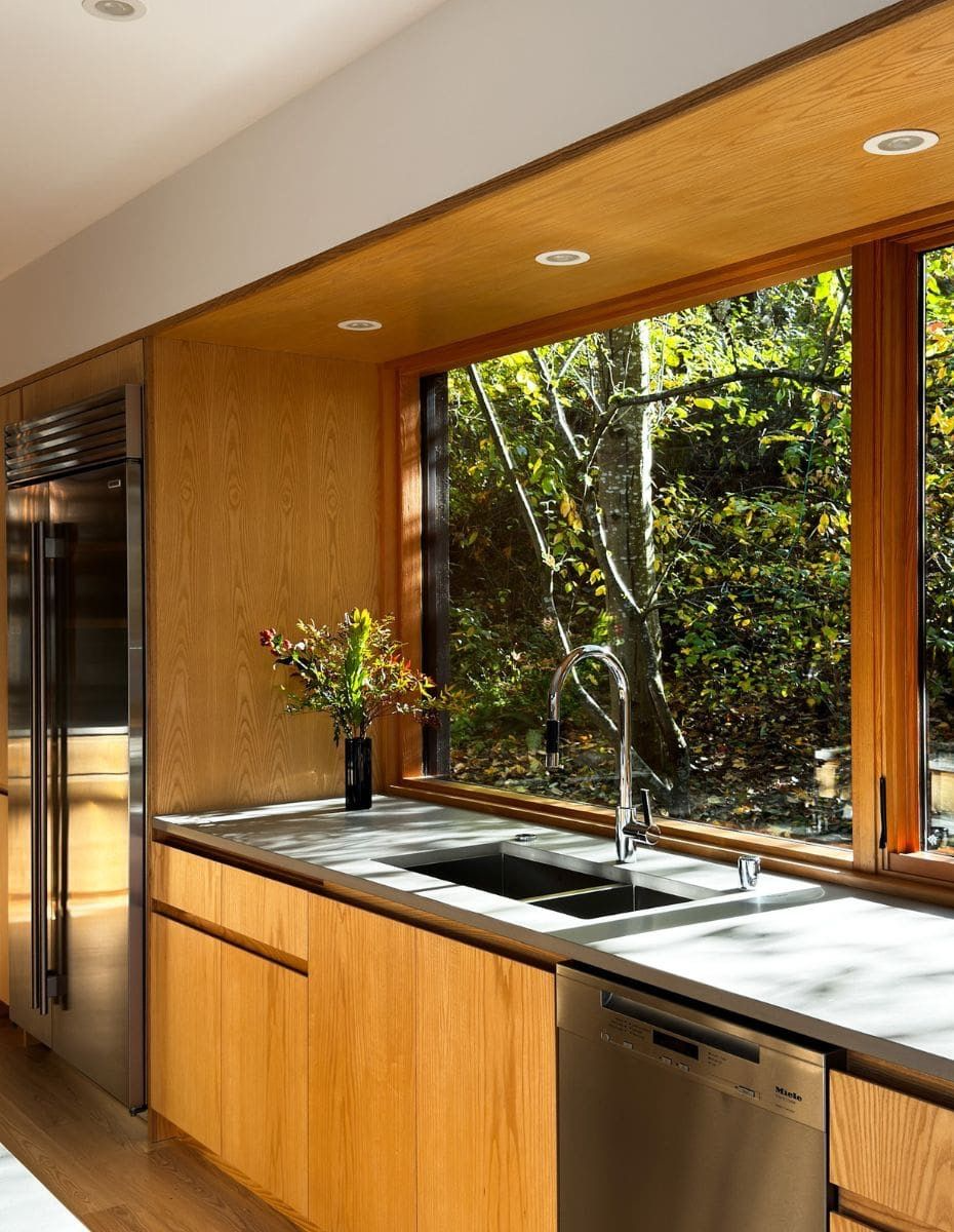 Open-concept West Coast Modern kitchen in East Vancouver character home with wood island and slate flooring