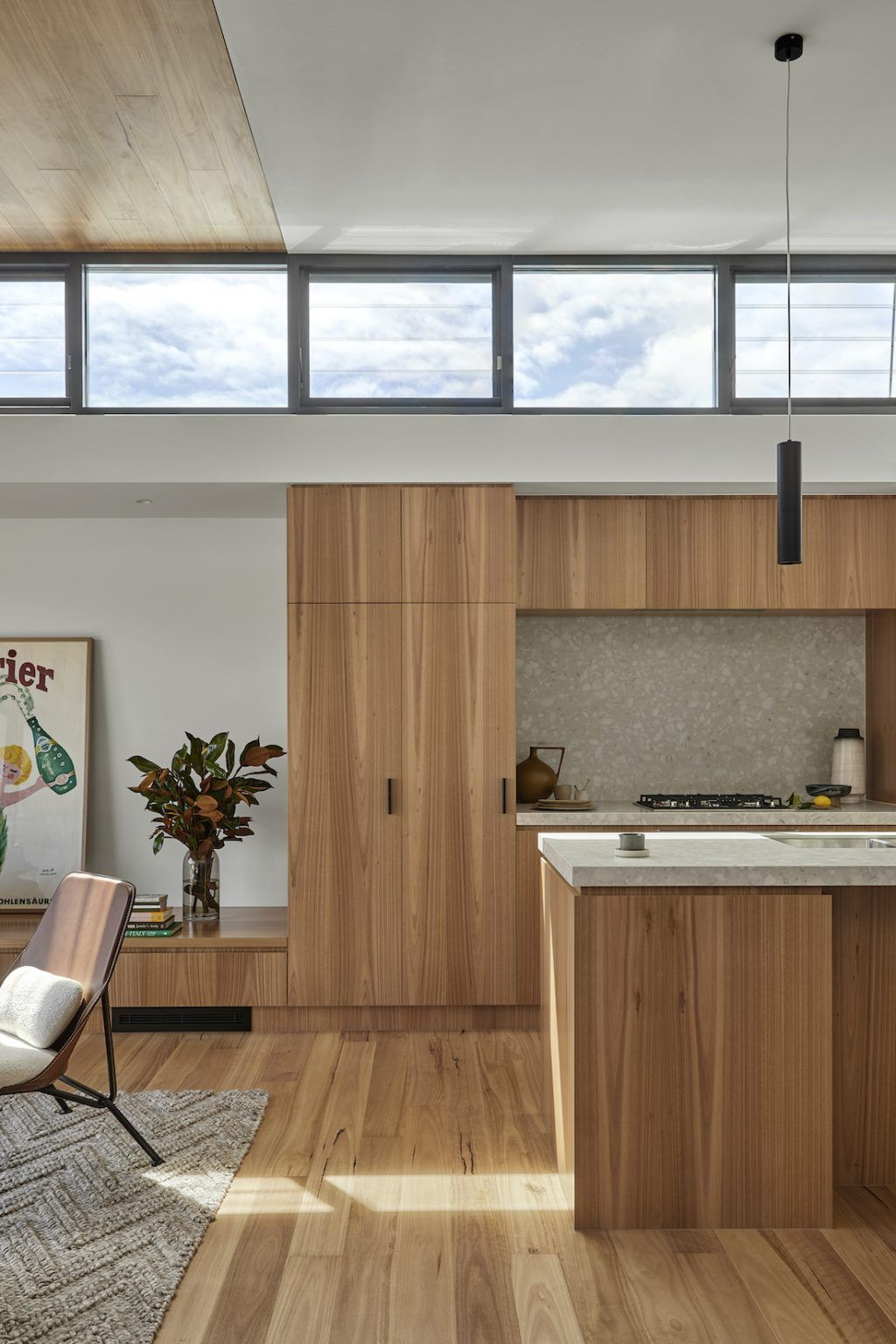 Vancouver laneway house interior with open concept kitchen and living area featuring warm wood tones and natural light