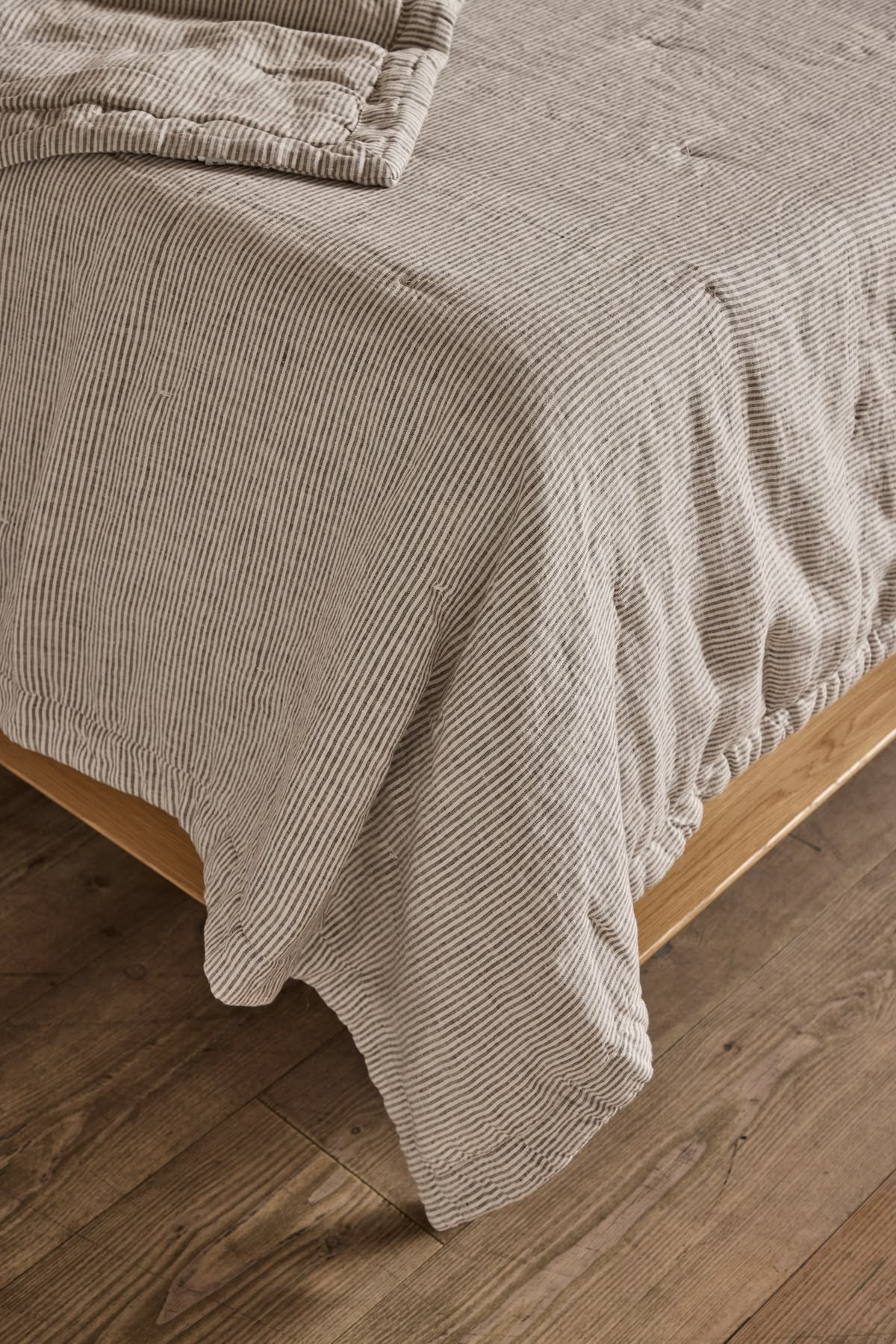 Low-VOC painted bedroom with organic cotton and linen textiles in a Vancouver condo