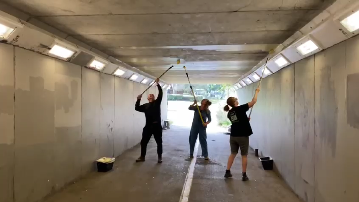Local Volunteers Paint the Underpass Roof