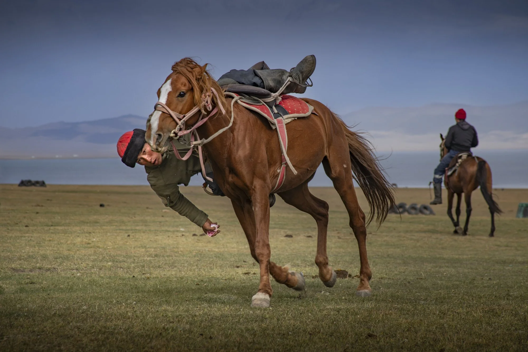 After the game the lads demonstrated their skills by picking up money from a galloping horse. 