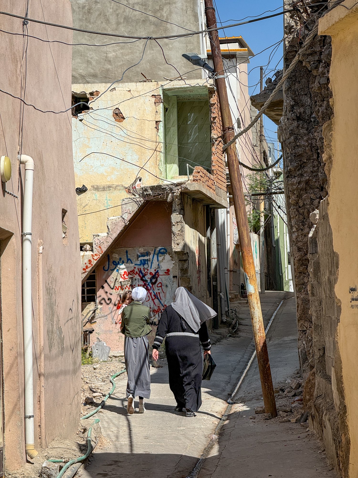 The battle scarred and bombed out old City of Mosul. Very few people can continue to live in their old houses. These alleyways, the only means of getting in and out of Old Mosul where made lethal by ISIS snipers.