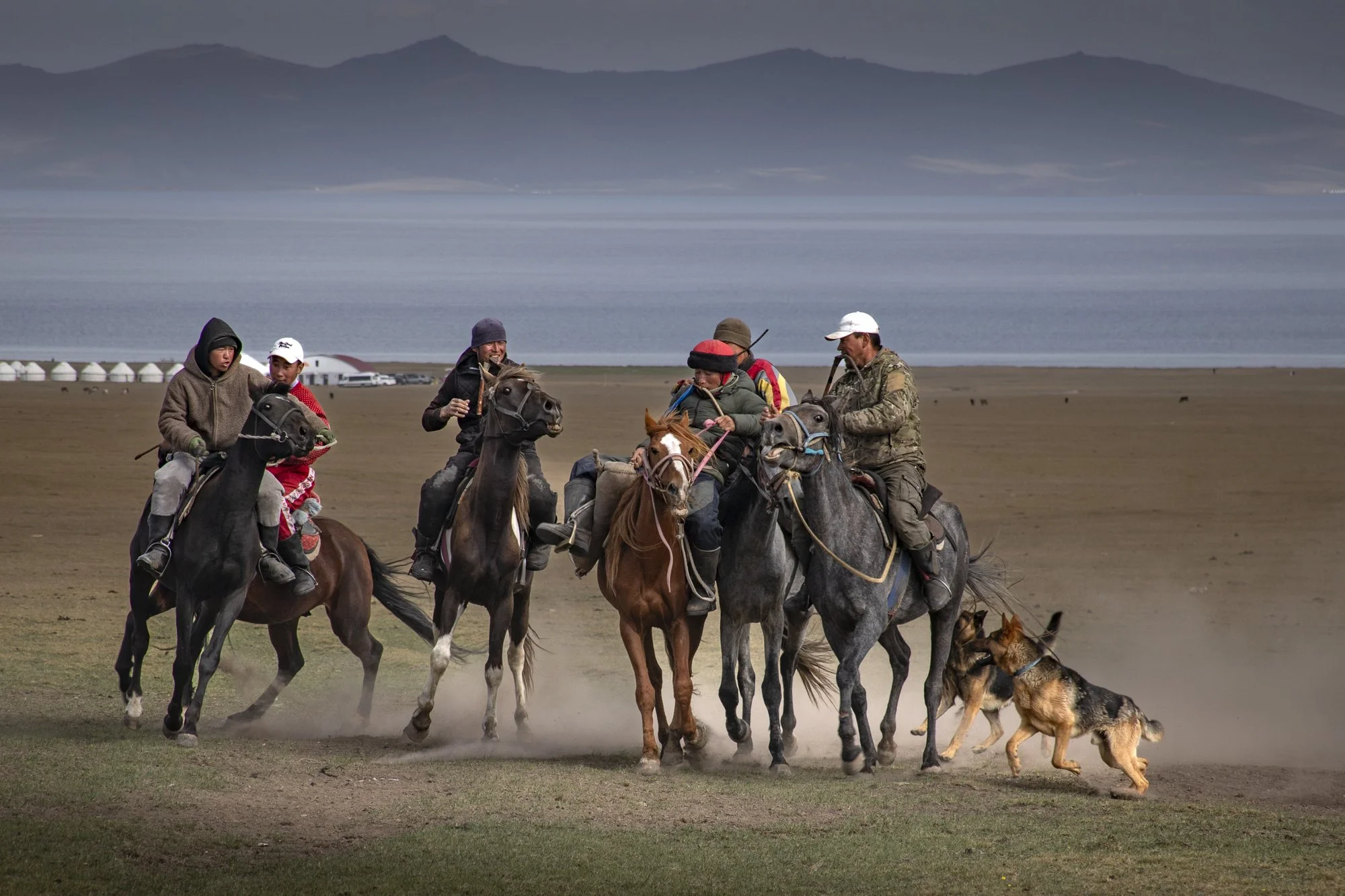 An impromptu match between local shepherds accompanied by their dogs.