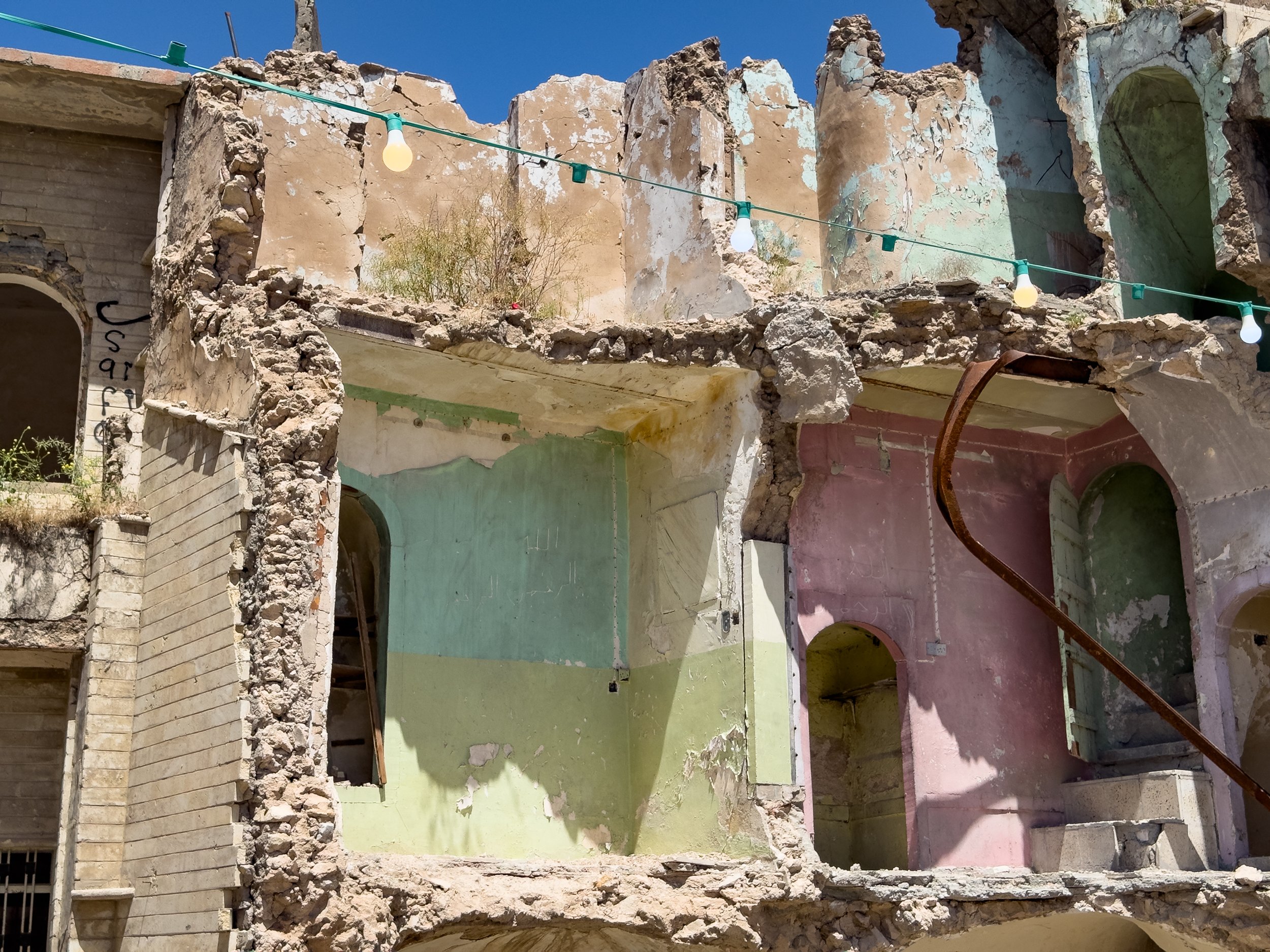 The bombed houses of Old Mosul reveal their interior colour schemes to the world.