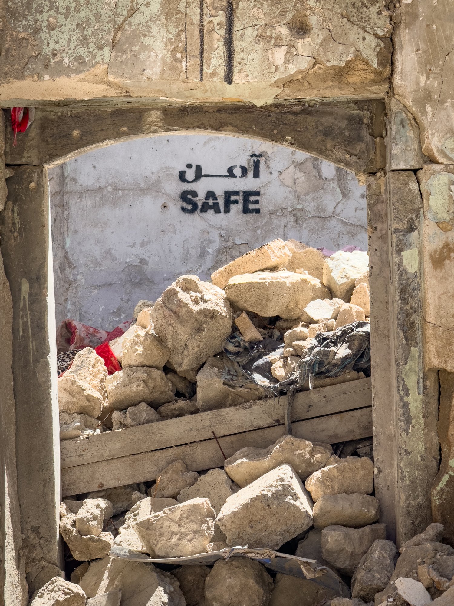 Some of the ruined buildings and homes of Old Mosul have been cleared of landmines and casualties and declared safe although uninhabitable.