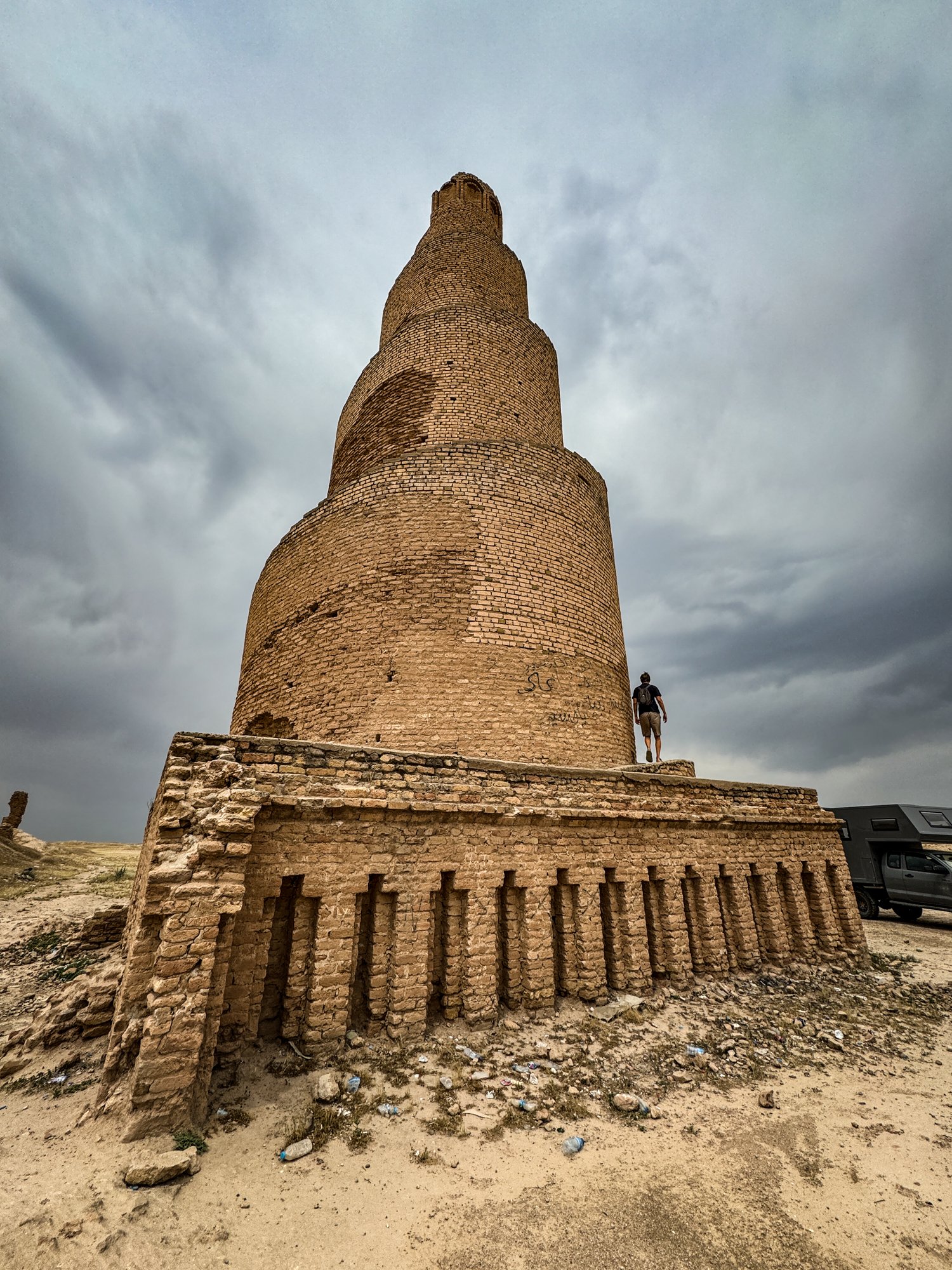 The Great Mosque of Samarra was built by the Abbasid caliph Al-Mutawakkil around 850 CE and largely destroyed by the Mongols. The minaret survived and is built in the shape of a cone, wrapped in a spiraling ramp that leads to the top.