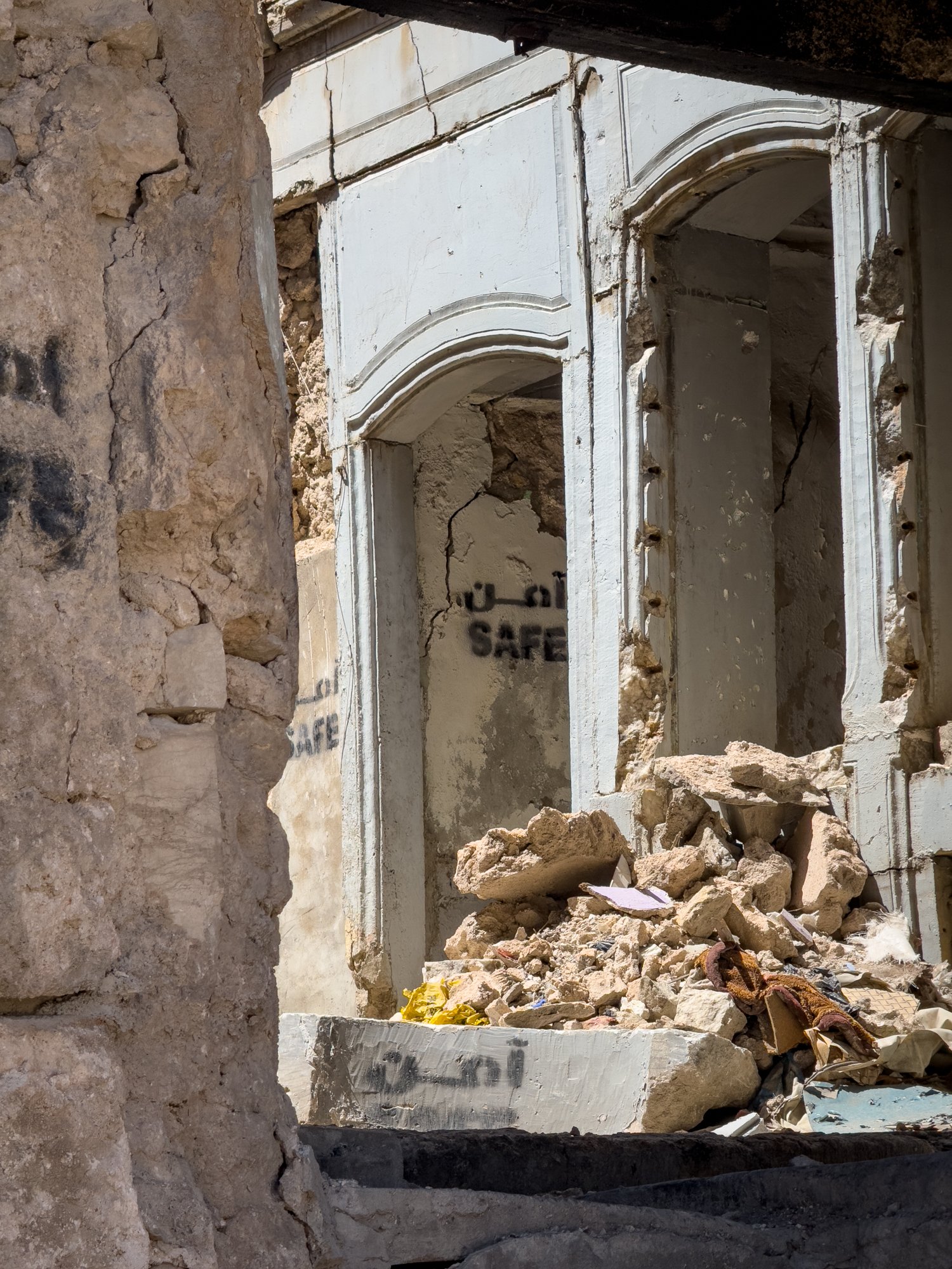 Some of the ruined buildings and homes in Old Mosul have been cleared of landmines and casualties and declared safe although uninhabitable.