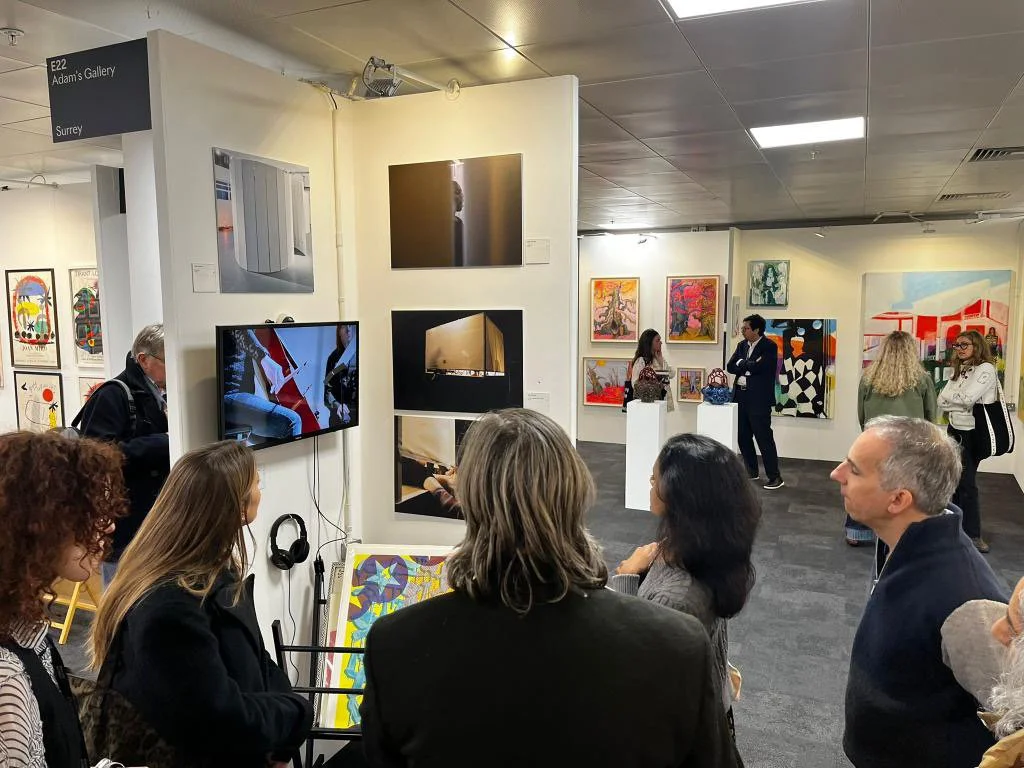 Discussing the work of Julie Groves with a tour group