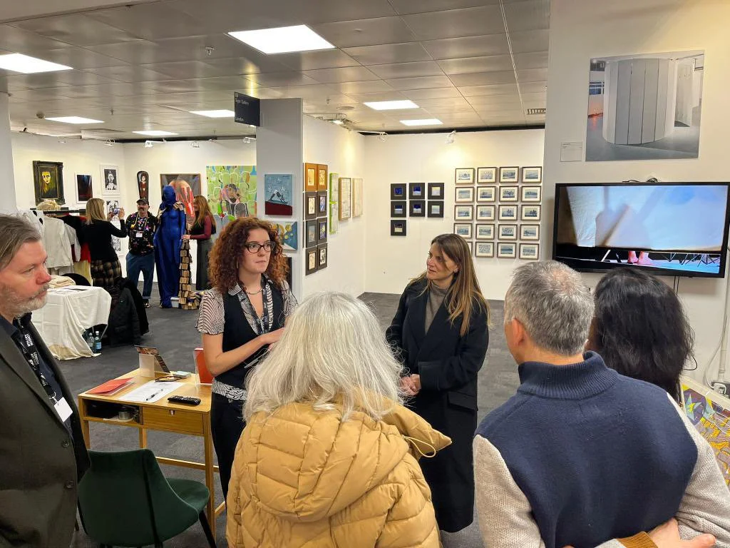 Discussing the work of Julie Groves with a tour group