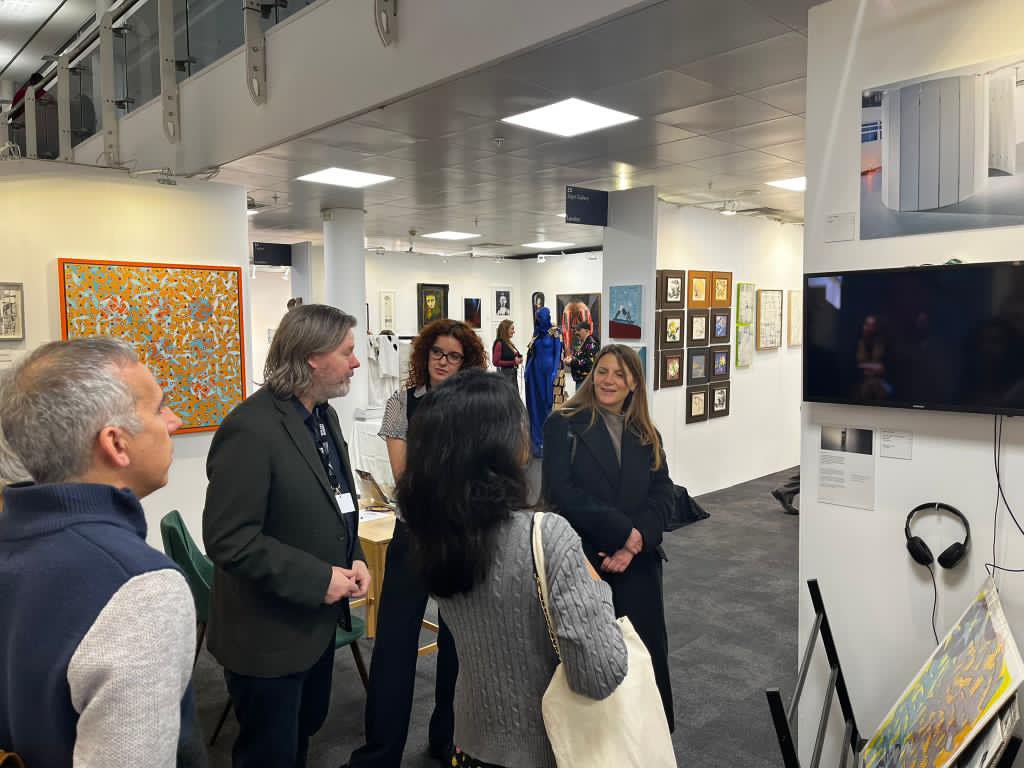 Discussing the work of Julie Groves with a tour group