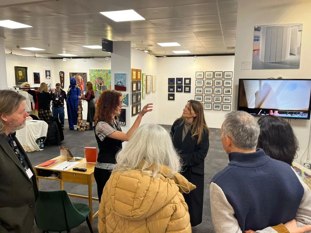 Discussing the work of Julie Groves with a tour group