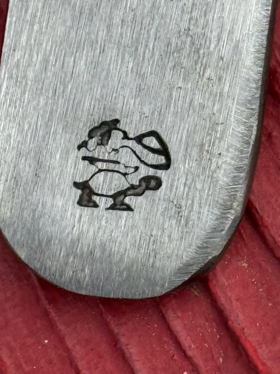 Greg Knoll, Clarksville Maryland, "rooster pecking an anvil on the back of a turtle"