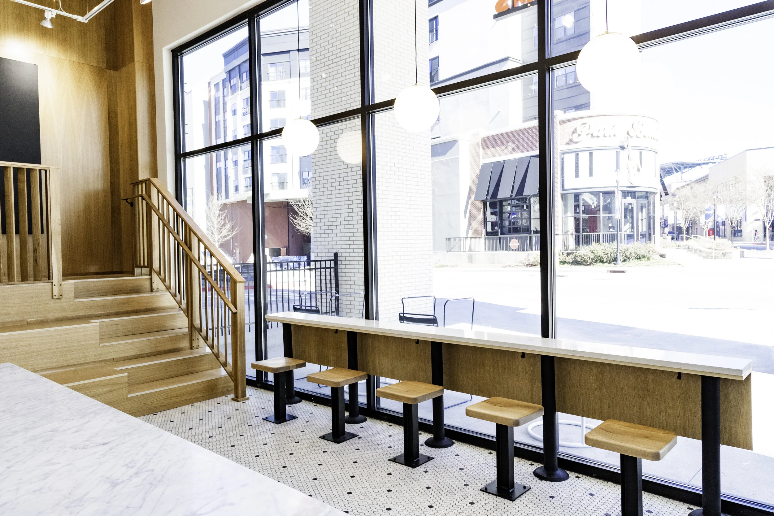 "Commercial general contractor tenant build-out for Jeni’s Ice Cream at The Battery Atlanta, featuring custom tile, high-end millwork, and installed kitchen equipment."

"Licensed commercial contractor interior build-out for restaurant café space at 