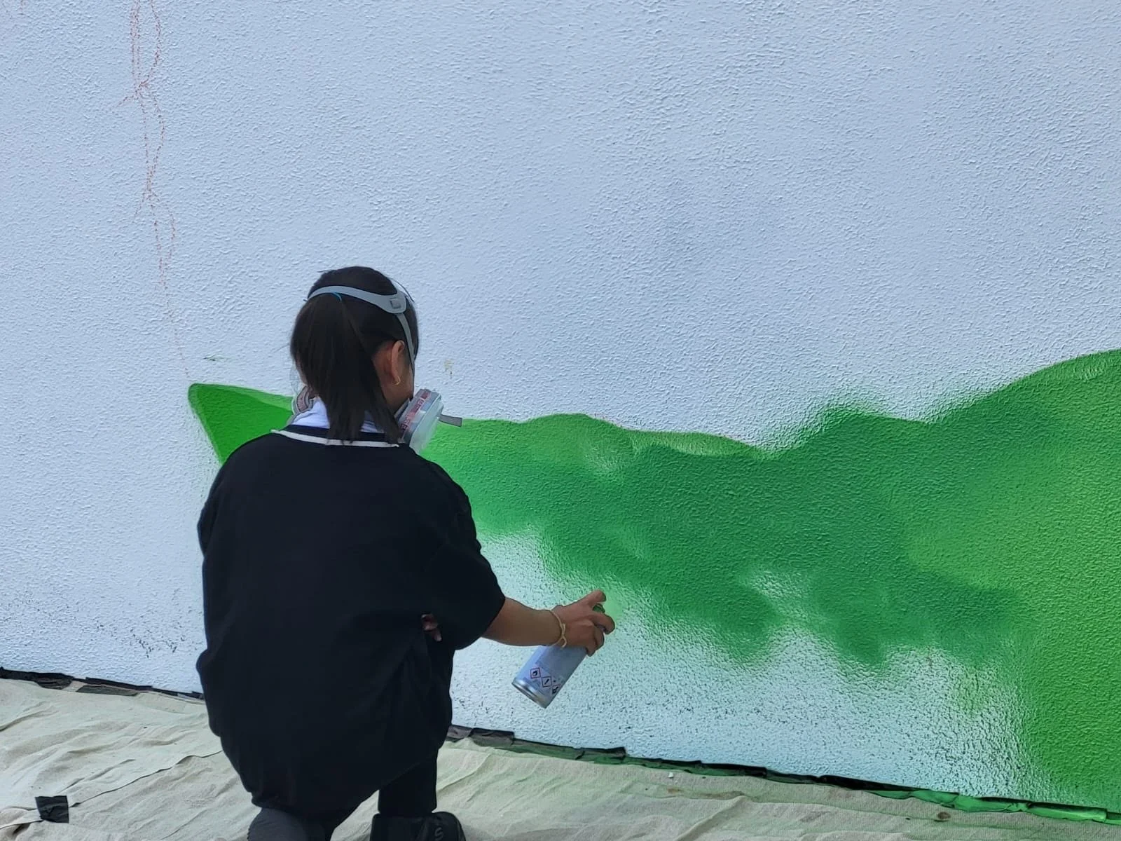 Taking turns spray painting