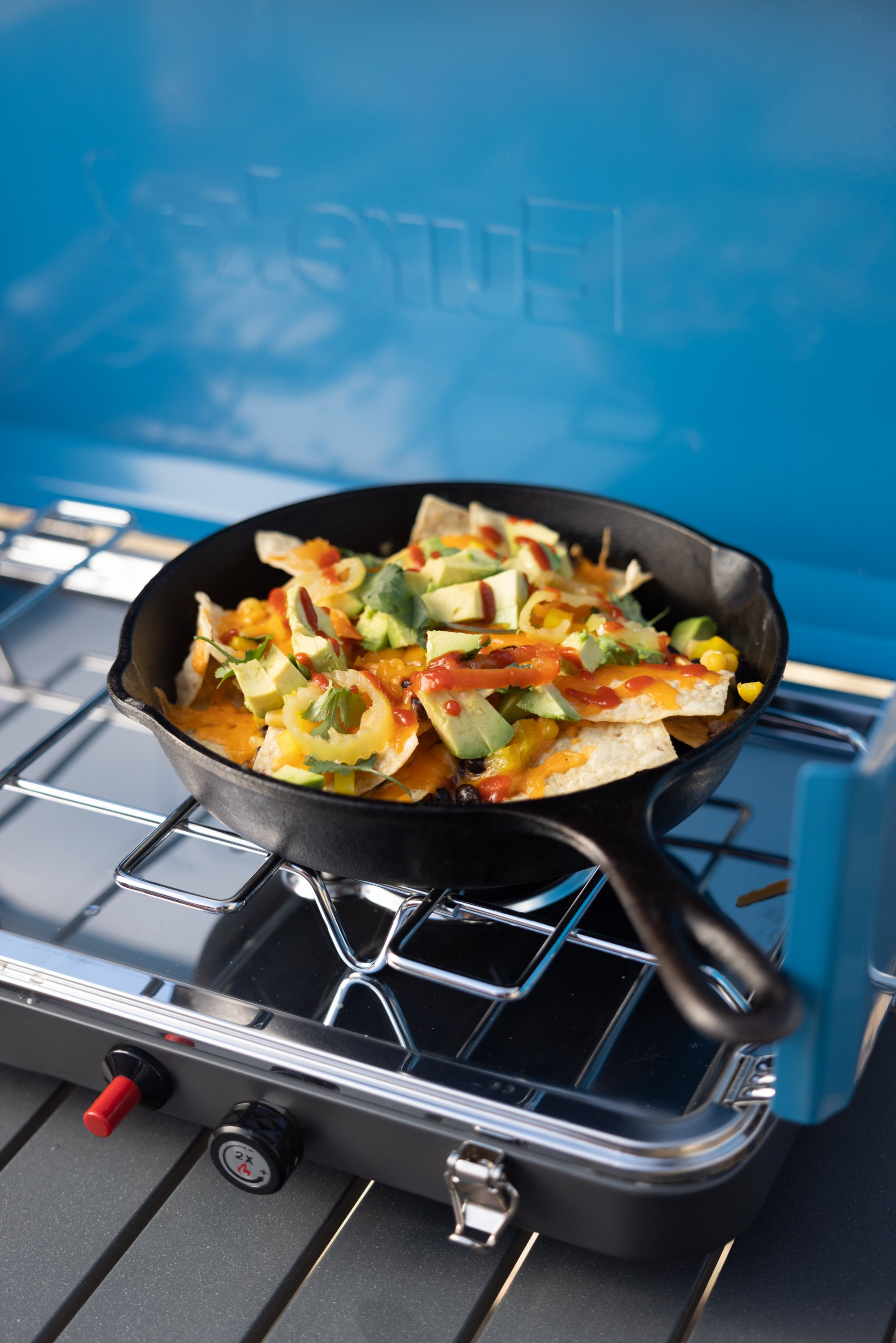 cooking on the camp stove with cast iron 